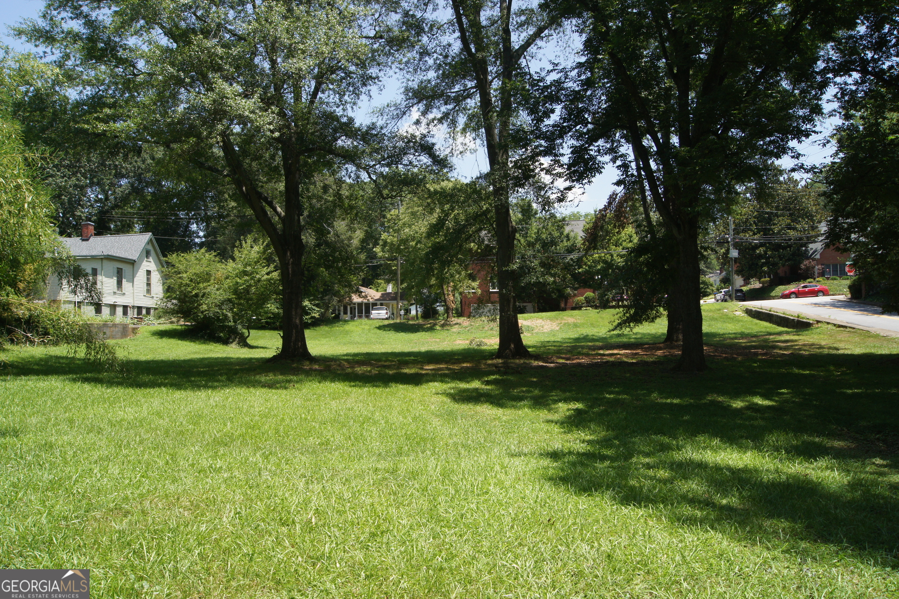 This beautiful residential lot near Downtown Gainesville offers the finest for homebuilding or developers investment opportunity. This .78/acre lot located at the corner of Bradford Street and North Ave offers the convenience of the Gainesville Square for dining, shopping and Historic Green Street. This corner lot offers mature trees for a peaceful setting but the convenience of the city. One of the most desirable areas in Gainesville, make this one of a kind lot the center piece of your future development plans. Call today for assistance!