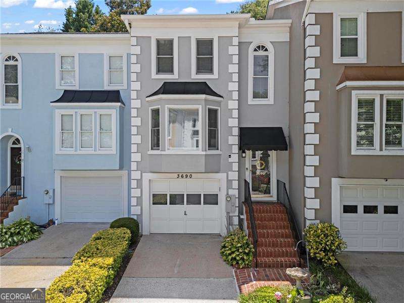 This Beautiful 3-Bedroom Townhome in a Quiet, Walkable Neighborhood is waiting for you. Move right into this spacious, light-filled 3-level townhome featuring 3 bedrooms, 3.5 bathrooms, and a thoughtfully designed layout perfect for both daily living and entertaining. Freshly painted throughout, the home boasts luxury vinyl plank (LVP) flooring and cozy carpet, offering style and comfort in every room. The garden bedroom with walk out to the dreamy backyard makes it perfect for office space or living space. Enjoy the natural light that floods the sunroom, creating a perfect spot for morning coffee or a home office. Each level offers generous space, with well-appointed bedrooms for added convenience and privacy. Located in a quiet community with access to the neighborhood pool, you're just minutes from shopping, dining, and major highways-making commutes and errands a breeze. Don't miss this move-in ready gem offering the best of comfort, convenience, and community!