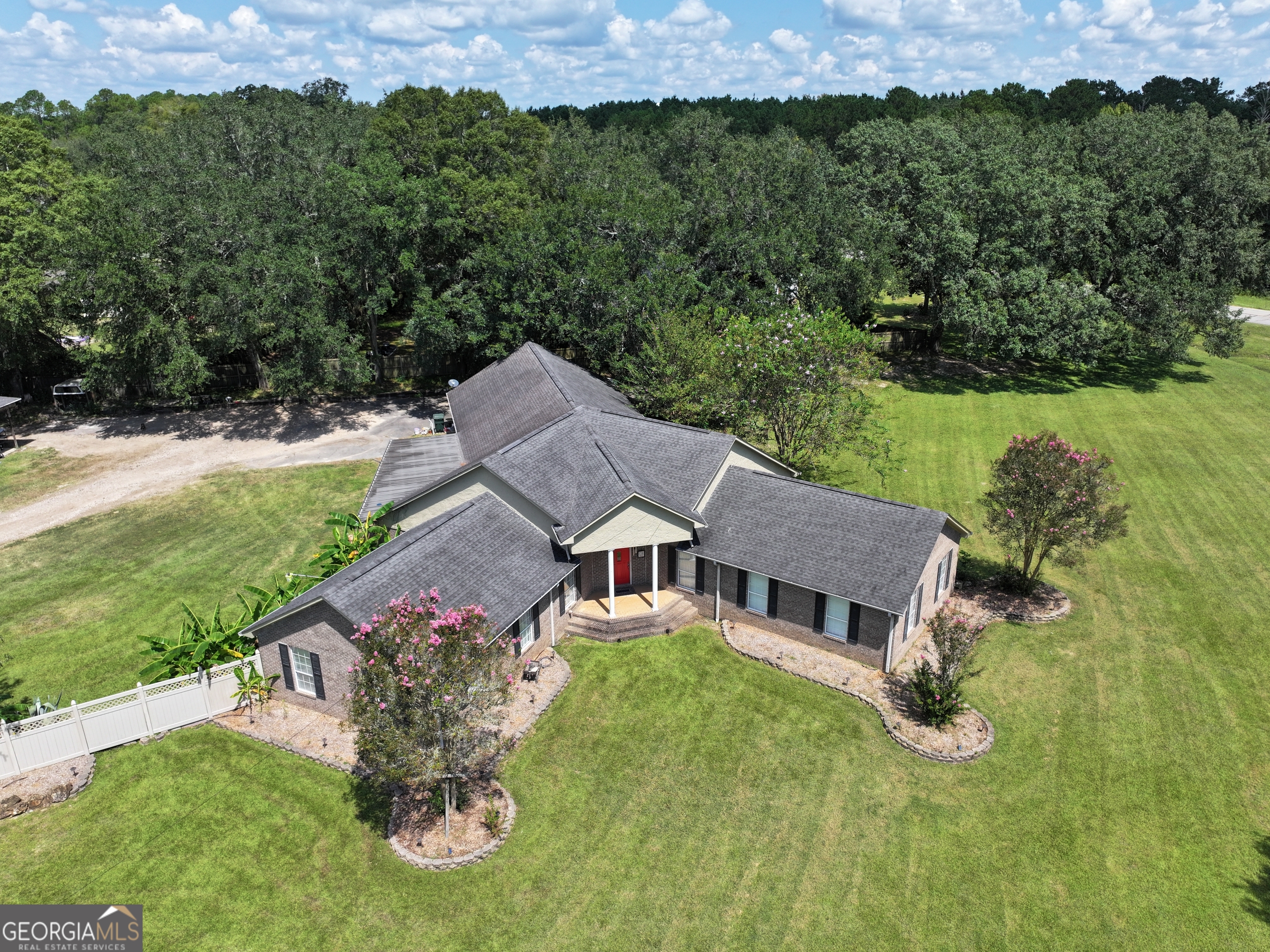 This 3-bedroom, 3.5-bath home offers 3,685 sqft of living space on 2.5 acres partially shaded by live oak trees. The spacious floor plan is designed for both everyday comfort and entertaining, with plenty of room for family and friends. Outside, the backyard is fully fenced and a 2-car carport provides convenient parking. Front porch and covered back patio provide additional outdoor living space.The property also includes an 864 sqft insulated shop with 10' ceilings, a window AC and heater, a covered front porch, and a 14x24 covered camper and trailer shed. Above the shop, you will find an unfinished studio with endless potential, along with 10x36 storage rooms on both levels that provide valuable extra storage space. Just minutes to the square in Blakely, GA, this home is ready to meet all your family's needs and goals.
