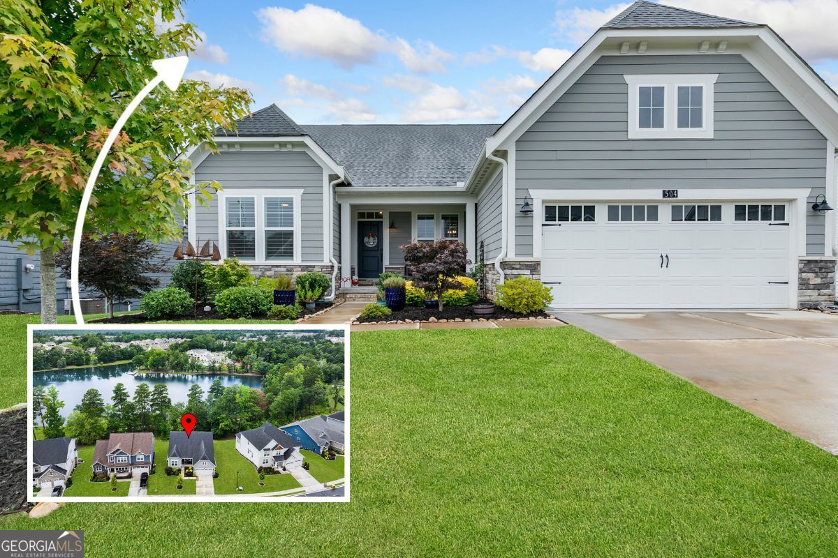 *OPEN HOUSE Saturday July 26 2-4* Watch the YouTube tour: https://youtube.com/shorts/Jf9C_qvQN8Y?feature=share At first glance, it looks modest. But behind the front door is a layout that's surprisingly spacious and full of smart, intentional design. This rare ranch floor plan in Twin Lakes delivers over 4,200 square feet of upgraded, thoughtfully crafted living space, set on a premium lake lot in one of Hoschton's newest and most amenity-rich communities. Inside, the home opens wide with natural light, tall ceilings, and a calm, open flow. The main floor gives you everything you need with an open-concept kitchen featuring quartz countertops, pull-out cabinetry, under-cabinet lighting, and a farmhouse sink, plus living spaces that feel both connected and comfortable. The primary suite is tucked in its own wing, with a spa-style bath and a walk-in closet that connects directly to the laundry room- a detail that makes everyday living so much more convenient. Two additional bedrooms on the main level share a hallway bathroom. And upstairs, there is a finished loft, bedroom, and full bathroom- ideal for guests, the coolest teen suite, or a quiet home office. Downstairs, the finished terrace level expands your options even further, with a media room, game area, additional bedroom, full bathroom, and the most organized unfinished storage you've ever seen. Off the kitchen is a quaint porch ideal for morning coffee or afternoon wine overlooking the wooded lake views that shift with the seasons- private in summer, open and scenic in winter. to enjoy the loveliest of sunsets. The upgrades continue throughout the entire house: plantation shutters on every window, a 240V EV charging outlet in the garage, Japanese maple trees, river rock borders, upgraded 6-inch gutters, and so many more. This home has been consistently and professionally maintained with monthly cleaning, HVAC servicing, pest control, and full lawn and landscape care. And Twin Lakes? It's easily one of the most exciting neighborhoods to hit Jackson County in years. It's more than just houses- it's a lifestyle. With two pools, a clubhouse, fitness center, private lakes, walking trails, a dog park, a kayak launch, and regular community events that bring neighbors together, it's one of the most connected and amenity-rich communities in North Georgia. The Publix shopping center sits just outside the neighborhood entrance, making it easy (and honestly kind of fun) to grab groceries by golf cart. If you've been holding out for a home that offers one-level living without compromise, this one's worth a closer look.