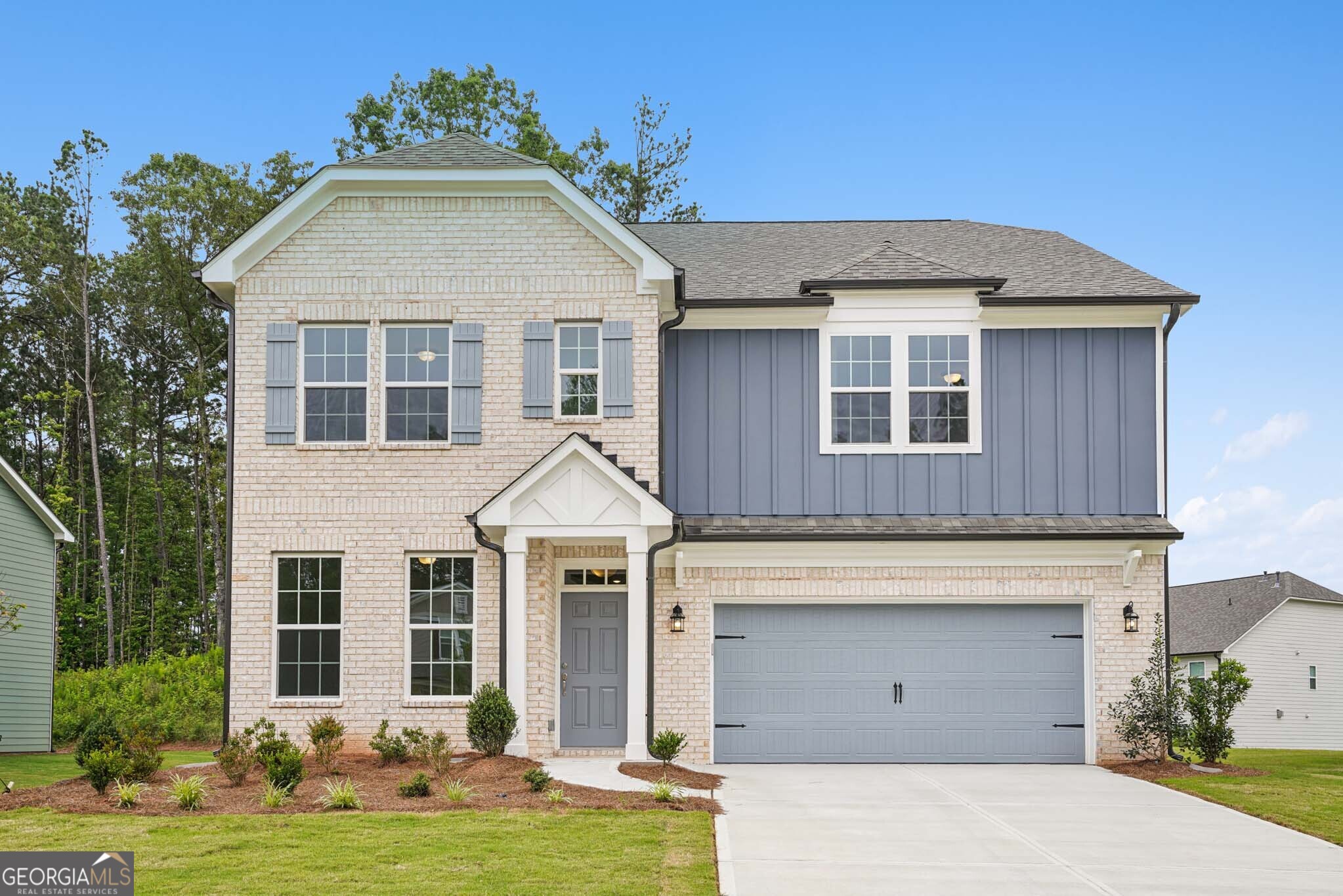 The Surrey spans 3,066 square feet of elegant living space, featuring 4 bedrooms, 2.5 baths, and a 2-car garage. The main level boasts a living room with French doors, a bright and inviting family room, a chef-inspired kitchen with modern finishes, a formal dining room, a mudroom for added convenience, and a deck perfect for outdoor enjoyment. Upstairs, the luxurious primary suite offers tray ceilings, a spa-like bath with a soaking tub and separate shower, and a spacious walk-in closet. A versatile loft provides additional living space, complemented by three generous secondary bedrooms and a full bath. A wooded covered patio offers endless possibilities to enjoy outdoors with friends and family. The Surrey combines comfort, style, and functionality to suit your every need. Heron Bay, located in Locust Grove, GA, offers a comprehensive suite of amenities designed to cater to a wide range of interests and lifestyles. At the heart of this vibrant community is the Lakefront Park, where residents can enjoy scenic views and outdoor activities. For golf enthusiasts, the Heron Bay Golf and Country Club provides a challenging and beautifully maintained course. Families and active residents will appreciate the aquatic center, tennis courts, and nature trails, which offer ample opportunities for leisure and exercise. Additionally, the community boasts a fitness center and children's play areas, ensuring that residents of all ages have access to recreational facilities. Heron Bay's commitment to a high quality of life is further reflected in its planned social events and activities, fostering a strong sense of community among residents. This home is available now. For further details and information on current promotions, please contact an onsite Community Sales Manager. Please note that these photos showcase the actual home.