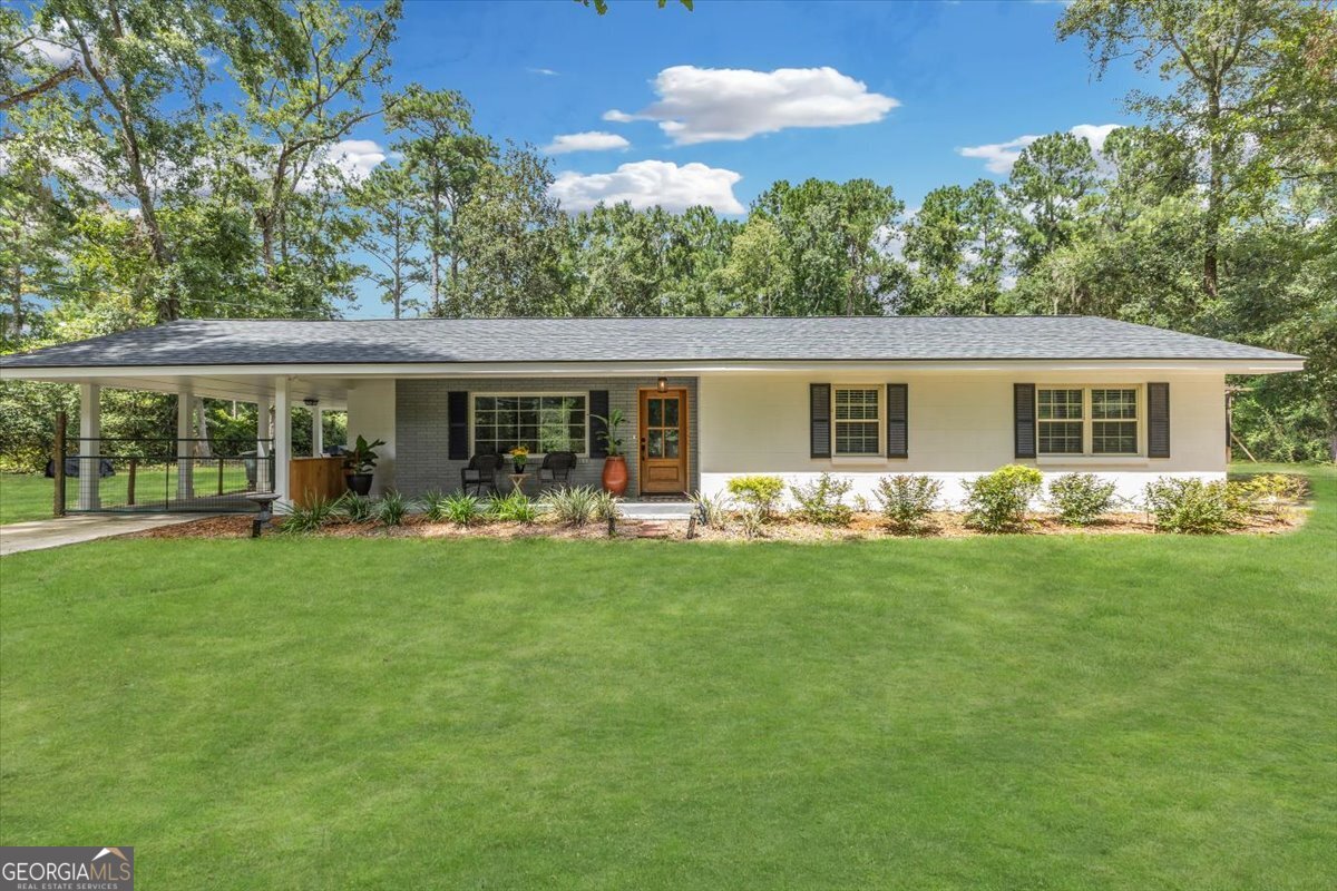 Discover your dream home at 509 Martin Rd in vibrant Hinesville, GA! This charming 4-bedroom, 2-bathroom oasis offers a spacious 1,956 sqft, providing the perfect canvas for a growing family or anyone who values ample space. Step inside this beautifully renovated gem, initially built in 1957, and be captivated by its cozy ambiance and thoughtfully designed layout. The warm living room welcomes you with open arms, while the modern kitchen, equipped with top-notch appliances, is perfect for whipping up delicious meals. Each bedroom is a serene retreat, ensuring you have the ideal space to unwind at the end of the day. But that's not all! This stunning home sits on a sprawling 1.01-acre lot, complete with a fantastic backyard ideal for entertaining. Picture hosting friends and family beneath the stars or storing all your outdoor gear in the permitted 24 x 32 pole barn with sturdy steel trusses and a 20-foot container shed! Plus, enjoy the beauty of wildlife right in your backyard. Conveniently located near schools, shops, and restaurants, this property truly has it all. Don't miss out on the opportunity to call this enchanting house your home!