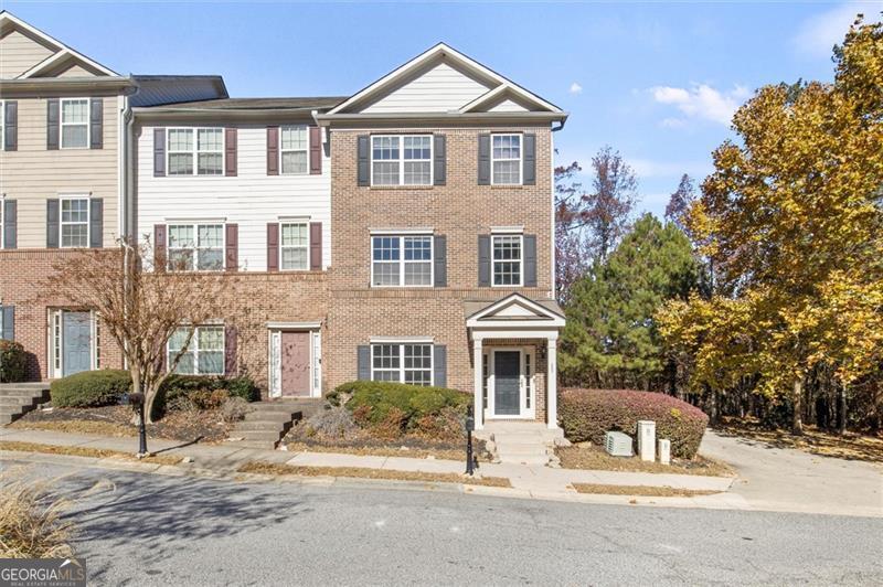 **Eligible for 100% Financing with Preferred Lender! (Restrictions apply-buyer must qualify.) ** Motivated Seller - Bring Your Offer!** Welcome to this updated end unit townhome featuring an open-concept layout perfect for entertaining, with a kitchen that boasts sleek quartz countertops, stainless steel appliances, and plenty of cabinet space. Upstairs, the spacious owner's suite includes a walk-in closet and en-suite bathroom, while the second bedroom is ideal for guests also with an en-suite bathroom. A washer and dryer are conveniently located on the upper level. Lower level has a bedroom with half bth ideal for home offices and the attached garage adds extra ease to your daily routine. Low monthly HOA fee includes yard maintenance, 24 hour security, and use of the clubhouse and pool which is just a short walk from the home! Conveniently located close to Camp Creek Marketplace, Hartsfield Jackson Airport, downtown Atlanta, Smyrna, West Midtown and more! This home offers the perfect blend of style and convenience-don't miss out!