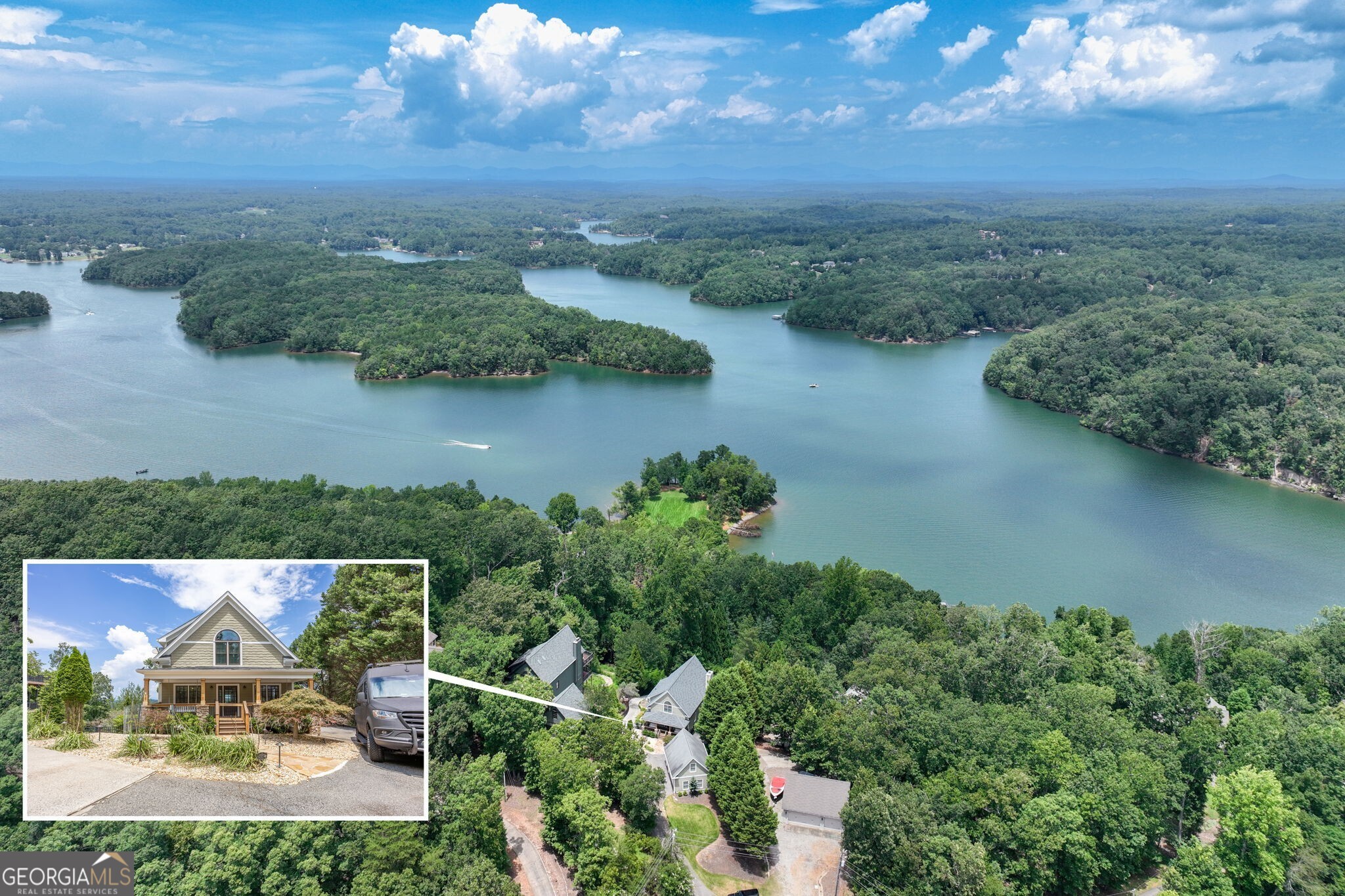 This stunningly renovated Lake Lanier retreat boasts lake and long-range North Georgia Mountain views! With 4 bedrooms, 4 full baths, an incredible flex space and resort-style amenities, this one of a kind property is perfect as a full-time residence, weekend escape, or short-term rental investment. This exceptional home has been completely renovated from top to bottom, with no detail overlooked and no expense spared. Perfectly positioned on deep, open water, it offers breathtaking views, a custom infinity saltwater pool, outdoor kitchen, a 32' x 32' double-slip dock with a party deck, boat lift, and two jet ski ports. Inside, the grand two-story great room impresses with floor-to-ceiling windows, gorgeous wood beams, and a striking custom stone fireplace. The chef's kitchen boasts top-of-the-line appliances, quartzite countertops, custom cabinetry, and an oversized island with waterfall edge, all part of an open, light-filled floor plan. Two guest bedrooms and a full bath are comfortably located on the main level as well. The private primary suite offers a luxurious, spa-inspired en suite bath, creating a serene retreat. The finished terrace level features 10-foot ceilings, a spacious media/rec room, a custom bar, full bath, guest bedroom, and access to a covered patio overlooking the sparkling saltwater pool. The detached garage includes a full bath and flex room above the garage, ideal as a guest suite, office, in-law or teen suite or bunk room. Ample parking ensures comfort and convenience for you and your guests. Designed for entertaining, this lakefront home features two expansive decks and an outdoor kitchen complete with granite island, beer tap, prep sink, refrigerator, stainless grilling station, and weatherproof flat-screen TV, ideal for watching the game poolside. Whether you're boating, lounging at the dock, soaking up the sun by the gorgeous saltwater infinity pool with built-in hot tub and waterslide, or simply taking in the serene lake and mountain views, this home offers the ultimate in lakefront living. All furnishings, the ATV, and the 2023 Tritoon are available for purchase, making this an incredible opportunity to step right into the lake lifestyle. Plus, it's conveniently located within minutes of GA 400, shopping and restaurants, but feels worlds away!