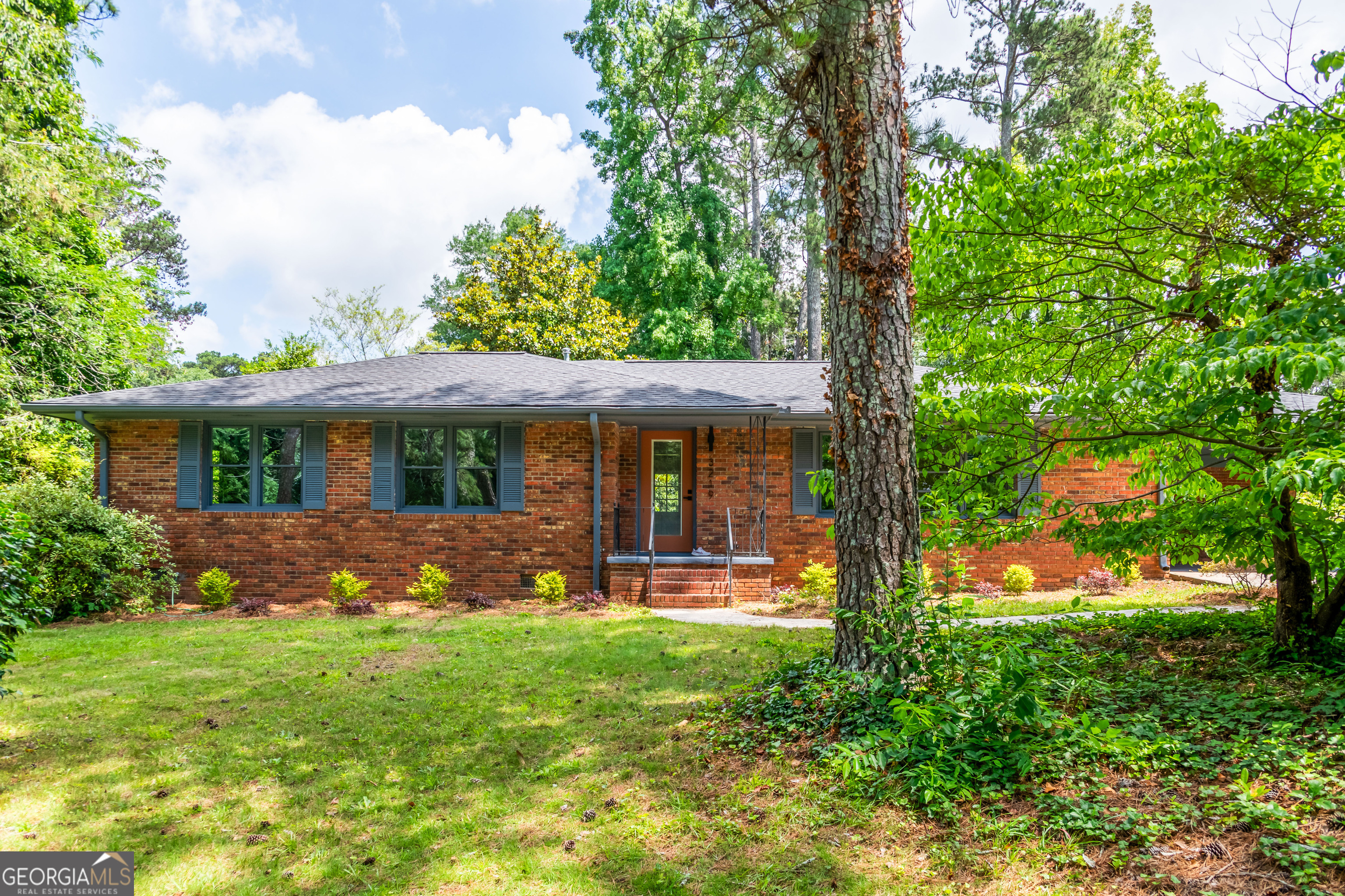 South West Atlanta Jewel! Welcome to this beautifully updated 3-bedroom, 2-bathroom brick ranch nestled on a spacious, tree-lined lot in Southwest Atlanta. With its classic curb appeal and fresh modern touches, this home is the perfect blend of timeless character and contemporary style. Step inside to find a light-filled living area with gleaming original hardwood floors, fresh paint, and stylish accents throughout. The updated kitchen opens to a large dining space and features sleek tile flooring, granite countertops, stainless steel appliances, and bar seating perfect for entertaining. Enjoy thoughtfully updated bathrooms, including a designer-tiled hall bath with modern fixtures and finishes. The layout flows seamlessly from room to room, offering both comfort and functionality. Outside, the lush front yard welcomes you home, while the private backyard offers plenty of room to relax or expand. **Location is everything **this home is situated within steps of West Manor Park, and just minutes from public transportation, restaurants, shopping, and local schools. With easy access to I-285 and all the conveniences of in-town living, this move-in-ready gem offers the best of both worlds.