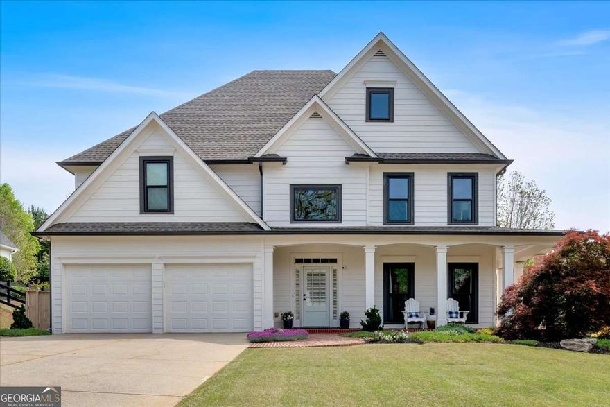 Move in and enjoy this stunning 4 bedroom, 3.5 bath traditional Williamscraft home. Convenient to everything-3 miles to Marietta Square with many dining and shopping options, less than 1 mile to Kennesaw Mountain Cheatham Hill trail and walkable to several restaurants and shopping. This beautifully maintained residence has upgrades galore with a new kitchen, custom reclaimed wood built-ins, new windows, new roof, HVAC, fixtures, lighting, updated baths, recently painted inside and out and high end french oak flooring throughout the main level. This spacious, elegant, open floor plan home is an entertainer's dream with a designer kitchen with custom wood hood, quartz countertops and open shelving. The kitchen is open to the 2-story family room with plenty of natural light and built-ins with a bar cabinet and storage. On the other side of the kitchen, the dining room has a built-in cabinet for coffee and a custom buffet with tons of storage and quartz countertops. From the dining room, pocket doors lead to the media room. Completing the first floor is also a half bath, large laundry room with sink and cabinets and sunroom/flex space for an office, playroom or studio. Upstairs there is a expansive primary suite with two walk-in closets, a sitting area and large master bath featuring a seamless glass shower, jetted tub and updated fixtures. There are three additional bedrooms - two bedrooms share a jack-and-jill bath. The fourth bedroom has its own private bath making it ideal for guests or a media room. Head outside to a huge, level backyard and oversized patio - where the possibilities are endless! You can also choose to relax in the screened porch while listening to the fountain. Easily add a hot tub with 220 outlet already installed. Neighborhood amenities include a newly renovated pool, playground and tennis/pickleball courts. It's more than a home, it's a lifestyle!     Additional updates include new  windows, roof, HVAC systems, hot water heater, fixtures, lighting, designer paint throughout,  custom cabinetry, landscaping, and more ~ leaving nothing to do but move in and enjoy.