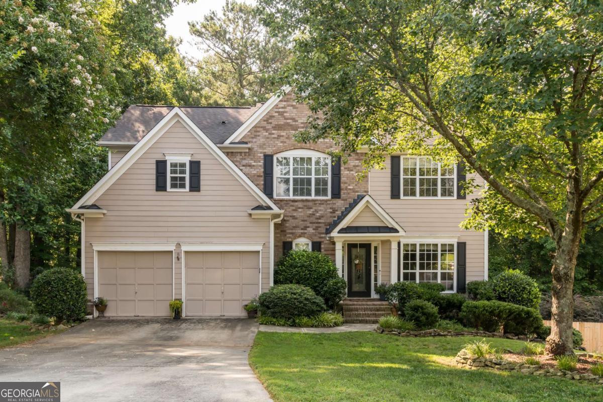 Hurry as this beautiful home is a rare find with 6.8 acres on a cul-de-sac in Forsyth County's Shepherd's Pond Subdivision! This home backs up to Big Creek Greenway and there is also Greenway access directly outside the neighborhood. Just minutes to Ga 400 and Halcyon gives so many options for dinners, shopping and family fun! The owners are leaving the sound system in the finished potion of the basement, which makes for great entertainment with movie nights and football weekends! The basement leads out onto a patio for grilling and relaxing next to the Koi pond. Thousands of dollars have gone into the landscaping, so all the work is done providing an abundance of beautiful and unique plants, including the overflowing of hydrangeas this time of year! There is a beautiful wood fence that was installed in 2024, perfect for dogs or kids to play, and beyond the fence is acreage making it a very private lot with endless possibilities! The Master bedroom has vaulted ceilings and his and her closets! Updates to the home include new LVP flooring upstairs in 2024, all new kitchen appliances in 2023, fresh paint throughout the entire house...trim, walls, doors and ceilings in 2022. Repaired and updated deck boards, freshly painted deck and the deck stairs were completely replaced in 2025. This home gets lots of natural light, has a really nice flow for entertaining and there is lots of unfinished space in the basement for a growing family. So many features make this a forever home..... acreage, greenway access, the safety for kids being on a cul-de-sac, walk out basement into your private backyard of 6.8 acres, neighborhood swim and tennis, and the fabulous location providing lots of fun things to do close by! Available for showings starting Monday, 6/30.