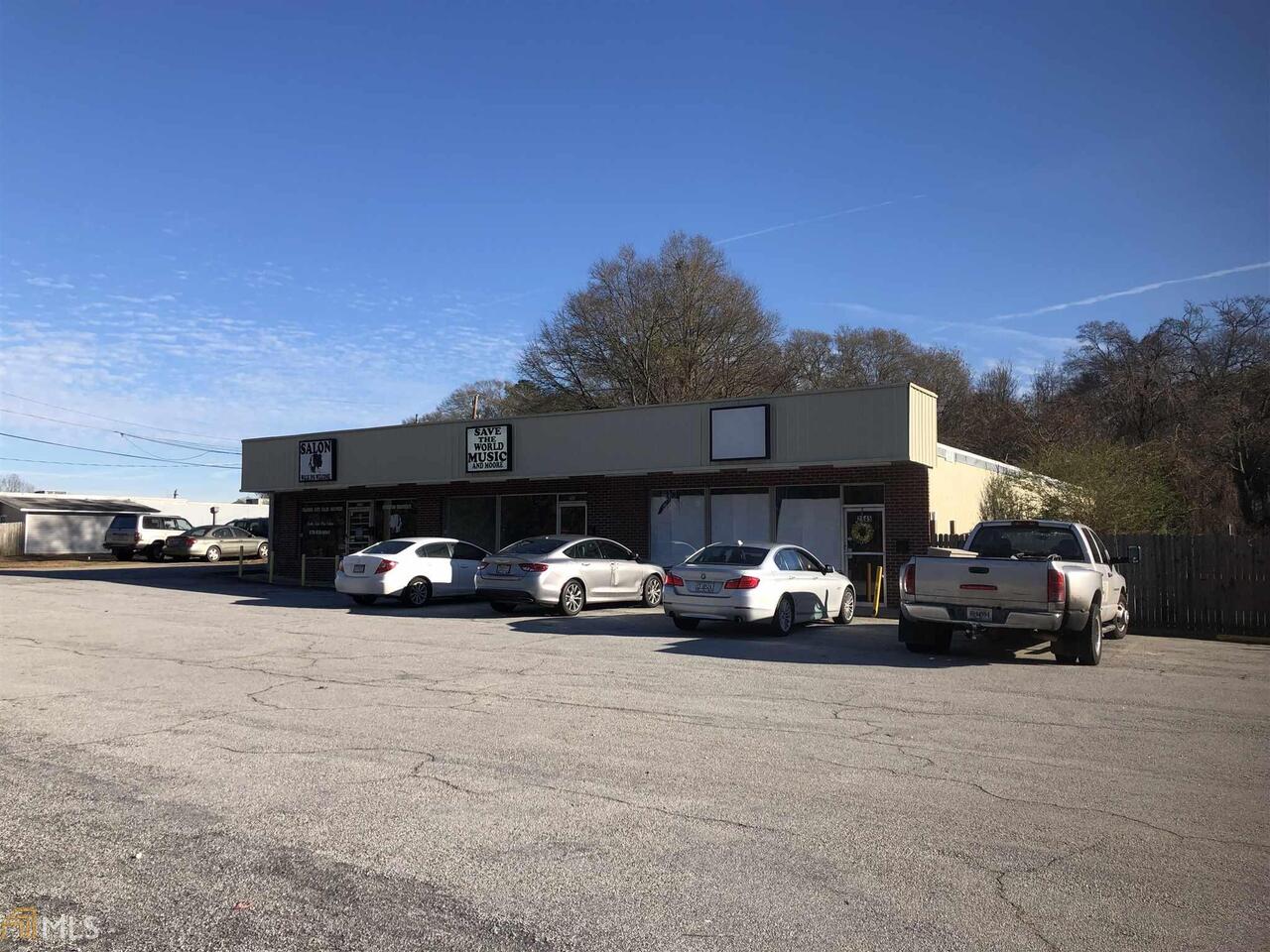 Opportunity to own income producing 3 unit strip center with additional legal lot to construct more square footage. Austell city zoning GC allows many uses. Call for details. One unit available for rent. Corner lot for many uses including fast food, office, retail. call for plat. *2539 Veterans Memorial Hwy (8430661) and 2545 Veterans Memorial Hwy (8593388) were sold together for $291,000*