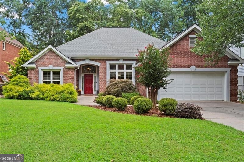 Your Brookhaven lifestyle upgrade starts here-welcome to this one-level charmer tucked into quiet Brookhaven Gardens, just a short distance from all the coffee, cocktails, and community vibes of Dresden Village. Whether you're downsizing from too much house or upsizing from too little function, this home fits just right. Soaring ceilings, hardwood floors throughout, and sunlight streaming through UV-rated windows create an uplifting energy from the moment you walk in. The heart of the home-the beautifully updated kitchen-features granite counters, slate backsplash, stainless steel appliances, 42" shaker-style cabinets, and a walk-in pantry. It flows easily into the vaulted living room with a slate-surround fireplace, built-in speakers, and access to a private, fenced backyard with lush landscaping and a paver patio that's perfect for morning coffee or evening unwinding. The oversized primary suite is a true retreat, tucked away for privacy, with tray ceilings, a spa-like bathroom with soaking tub, frameless glass shower, dual vanities, and a generous walk-in closet. Three additional bedrooms are thoughtfully laid out for optimal space and privacy-one even includes a cedar-lined closet. Outside, enjoy year-round custom landscaping, stone retaining walls, raised garden beds, and an irrigation system to keep everything thriving with ease. The garage includes 220V power and its own A/C system-ready for a workshop, gym, or future flex space. With a newer HVAC, tankless water heater, plantation shutters, extensive trimwork, and a security system already in place, this home is truly move-in ready. All of this just minutes from Brookhaven's best parks, restaurants, and shops - making life easier, richer, and more connected. This Brookhaven charmer home checks every box.