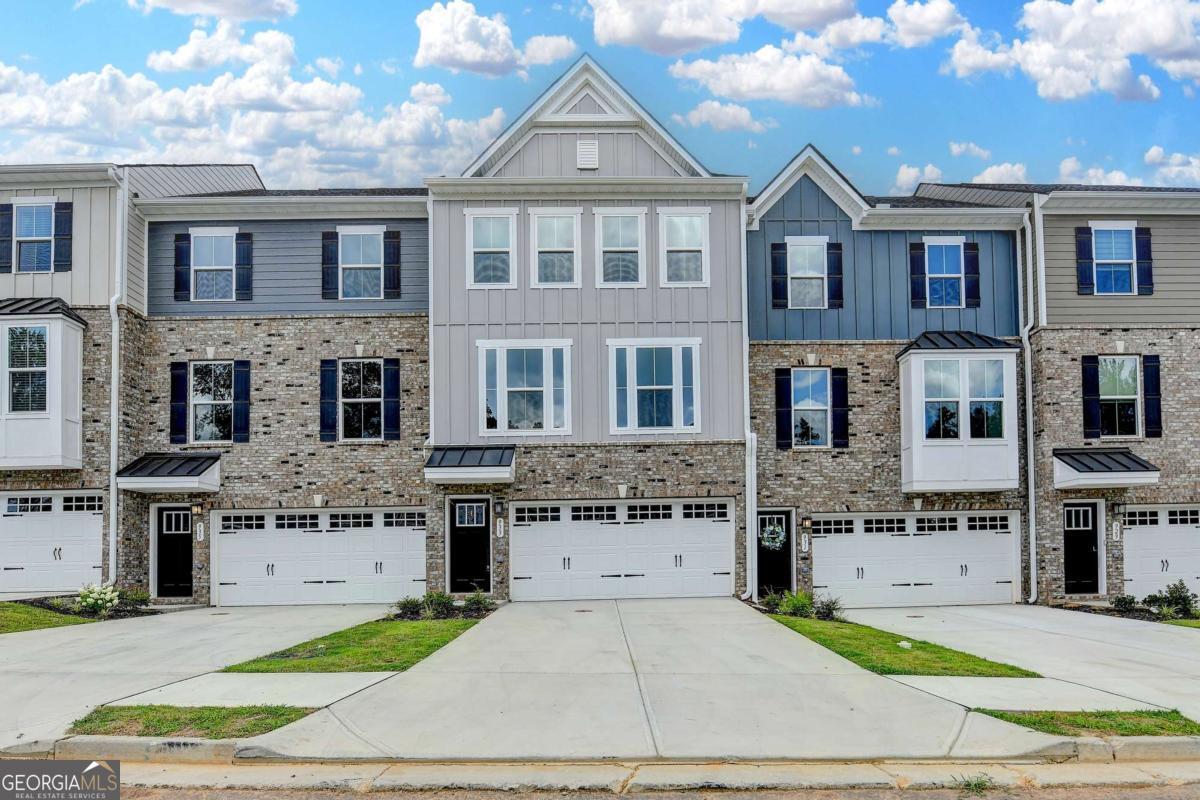 Beautiful modern designed NEW CONSTRUCTION in a sought-out area! LOCATION, LOCATION , LOCATION!!! Enjoy this 3 bed-2 1/5 bath! RYAN HOMES newest community in Sugar Hill. This home features a unique design that offers space and privacy! Lower Lever has flex room that can be a retreat getaway or a recreational fun gathering spot! Main Level features Chef-style kitchen with beautiful white countertops and SS appliances. Wall of Windows provides great natural light! Upper level has Primary bedroom and spacious bedrooms and baths! Primary bath has both Tub and Shower! home walk in closets, upper laundry and more!This home has convenient access to shopping, dining, and entertainment! Just minutes away from the Mall of Georgia. Great schools! Easy access to Interstates. Schedule a showing today to see Ryan Homes newest luxury condos! Small pets ok.
