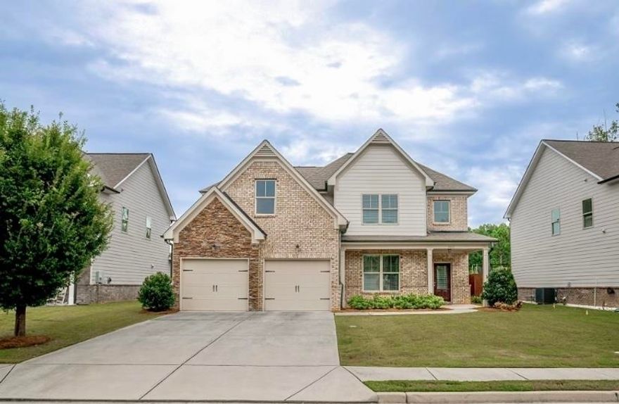 FORMER MODEL HOME - This beautiful, well-maintained home will be the perfect setting for the upcoming holidays. Like new, one owner, 2-story with brick front and a welcoming front porch. The amazing kitchen features a walk-in pantry, beautiful cabinets, oversized island with stone counters. Stainless steel appliances including refrigerator remain with house. The kitchen is adjacent to the breakfast room and opens to the generous family room with a gas fireplace and stunning coffered ceiling. A must see! The Impressive owner's retreat on main includes an elegant bath with separate oversized shower, soaking tub and dual sinks. The main floor also incudes a formal dining room and large laundry room. Upstairs you will find an additional full bath, 3 spacious secondary bedrooms plus an impressive bonus room that could be converted to movie room, game room, oversized office, guest room the possibilities are limitless. All of this sits on a level lot with a sprinkler system built-in. The backyard has an impressive covered patio and privacy-fenced. Only 10 minutes from the Mall of Georgia. Seller strongly prefers to close with O'Kelley & Sorohan.