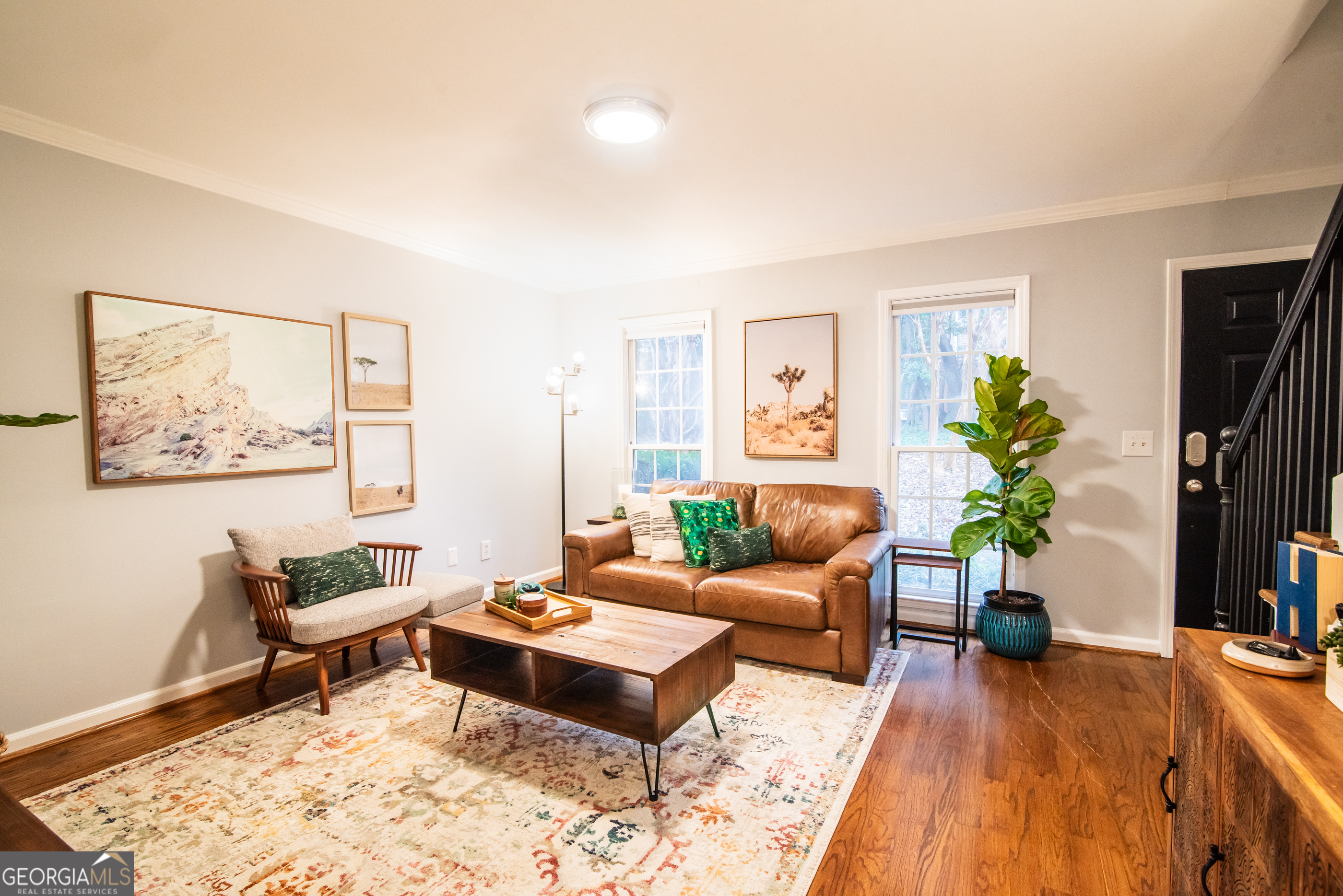 Behold! The Carlyle Square community has long captured your gaze, and at last, the listing you've been waiting for has appeared just in time for the friends to shower you with housewarming gifts for the holidays! Tucked into Atlantaas Upper Westside, the location is a hop, skip and a jump from the delights of The Works, Atlantic Station, and Westside Provisions. And with Publix, Felinni's and much more shopping all within walking distance, the world is your oyster. Inside the gates of this cozy community, the amenities are impressive, but first let's talk about this 2 bedroom, 1.5 bath townhouse that's the real VIP! It's a peaceful oasis with no noisy neighbors above or below, with sparkling hardwood floors throughout that are a breeze to maintain. And with HOA fees below $455 per month (including water!), you won't break the bank and youall get the amenities you actually want covered by your HOA--a pool, fitness center, and club house all await you. The fresh coat of paint and well-maintained systems mean you can move in without any hassle. And when you need to stretch your legs, the enclosed patio doubles your living and hosting space. All these boxes checked, and it's only listed at $290K. It's time to schedule a visit and see for yourself why Carlyle Square is the perfect place to call home!