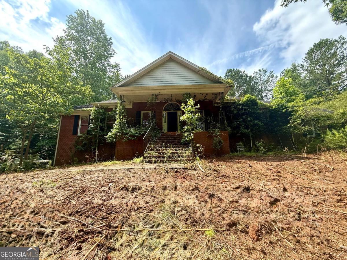 Private Retreat on 17+ Acres Near Mirror Lake - Endless Potential Awaits! Located only 2.6 miles from the sought-after Mirror Lake Golf Community, this property combines rural charm with close proximity to golf, shopping, dining, and community amenities. Families will also appreciate the convenient school access - just 1.1 miles to Mirror Lake Elementary, 2.7 miles to Mason Creek Middle, and 6.9 miles to Douglas County High School. The home features a solid 4-sided brick exterior, a spacious layout, and an unfinished basement with both interior and exterior access - perfect for future expansion, storage, or customization. A fenced 3-acre section surrounds the home, ideal for pets, gardening, or outdoor living. While this property is a fixer-upper, it's full of potential and offers a self-sufficient lifestyle with well water and septic system already in place. Whether you're looking to renovate for your personal retreat or as an investment, this is a rare find with tremendous upside. Buyer Incentives with Preferred Lender:?Use our preferred lender and receive a covered appraisal fee plus a 1% lender credit to buy down your interest rate in the first year.?Need flexible loan options? Our lender offers 20+ jumbo loan programs tailored for all types of buyers. Property is being Sold As- Is - Bring your vision to life and transform this property into your private countryside retreat. Don't miss the opportunity to own a spacious estate with plenty of room to grow, plus financial incentives that make ownership even more attainable!