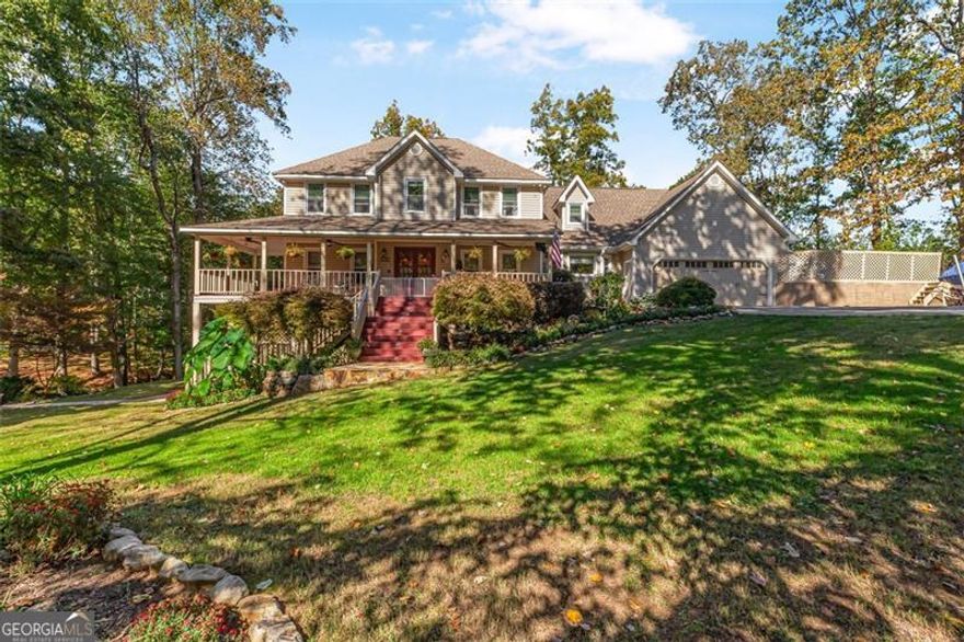 Welcome to your private lakeside retreat - a rare opportunity to own two adjoining lots totaling over 2.8 acres of beautifully landscaped property, including 31 Fawn Lake Trail NE and the adjoining 29 Fawn Lake Trail NE (1.2 acres). This expansive estate offers the perfect blend of nature, privacy, and modern comfort - with nearly 4,900 square feet of finished living space, including a top-quality finished basement apartment ideal for guests, in-laws, or additional income potential.  Enjoy the charm of the wraparound front porch overlooking lush gardens and mature trees, or take in peaceful water views from your private back deck and hot tub. The property's open grounds provide endless possibilities - plenty of space to add a pool, soccer field, or outdoor entertaining area.  Inside, the home is designed for comfort and versatility, featuring 5 spacious bedrooms, 3.5 baths, and multiple bonus areas, including an upstairs flex room perfect for an office, craft space, or storage. The renovated kitchen boasts granite counters, double ovens, a gas range, stainless-steel appliances, and a new dishwasher. The main-level bath has been fully remodeled with a walk-in shower, and the home includes numerous recent upgrades:  New HVAC systems for the basement and main level  Tankless hot water heater  Six new upstairs windows  Newly painted decks  New outdoor hot tub with deck extension  A detached second garage/workshop offers abundant storage and parking for vehicles, boats, or hobbies. From the tranquil lakefront dock to the beautifully manicured gardens, every inch of this property has been lovingly maintained for the ultimate indoor-outdoor lifestyle.  Perfectly located in a quiet, wooded community - yet minutes from schools, shopping, and local conveniences - this home combines privacy, space, and scenic beauty in one of the area's most desirable settings.