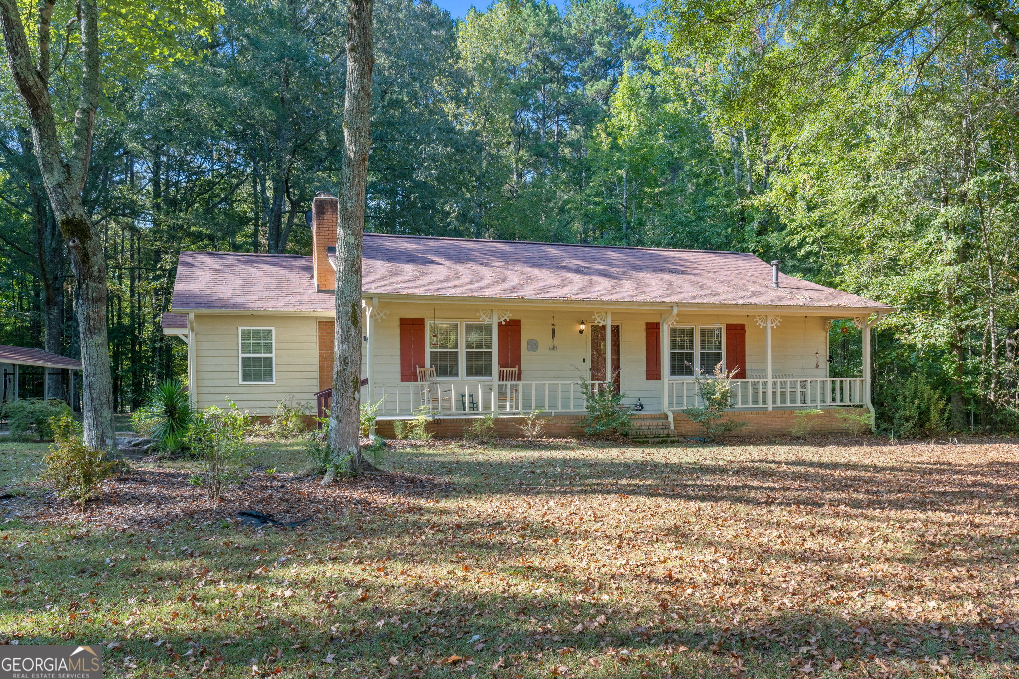 Just Listed in Whitewater School District! Welcome home to this charming ranch located just one mile from Brooks, GA. Nestled on 1.5 private, level acres, this fully fenced property with gated entrance offers both comfort and functionality. Step inside to find luxury vinyl plank flooring throughout, a spacious family room with fireplace, and a heated/cooled finished sunroom perfect for year-round enjoyment. The large kitchen features abundant cabinetry, a pantry, and a bright breakfast room. The home offers two generous bedrooms, including an owner's suite with a private ensuite bath. Enjoy outdoor living on the welcoming rocking chair front porch or the back deck just off the laundry room. Car enthusiasts and hobbyists will love the oversized three-car detached garage, complete with electricity, heating, cooling, and new lighting, plus a carport. Two additional outbuildings provide extra storage-one with power. The property's well is equipped with a whole-home water filtration system. Recent Updates Include: Serviced HVAC system, replaced septic field lines & pumping of tank, new bladder tank for well, new microwave with exterior vent protection, installed garage overhead lighting, Newer roof with gutter guards, New garage window unit, recently updated flooring throughout & 40-gallon electric water heater. All of this on a quiet street with no HOA-a true gem that has been loved and well maintained. Call today to schedule your private tour!