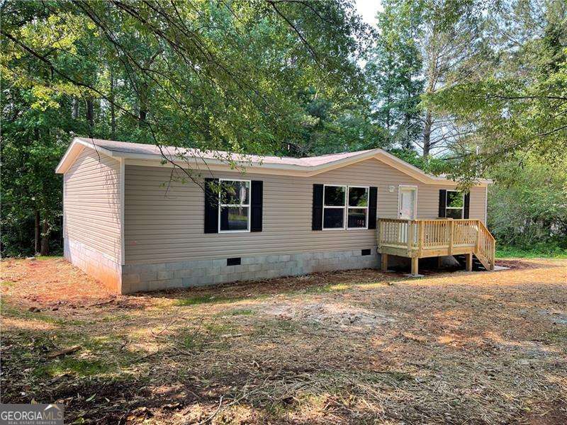 Brand-new 3 bed, 2 bath home on nearly an acre with everything freshly installed-roof, HVAC, appliances, floors, and more. With 1,264 sqft of open living space, it features a split-bedroom layout, large kitchen island, walk-in closet, and modern finishes throughout. Concrete driveway coming soon-just waiting on final power and inspection, and it's ready to go!