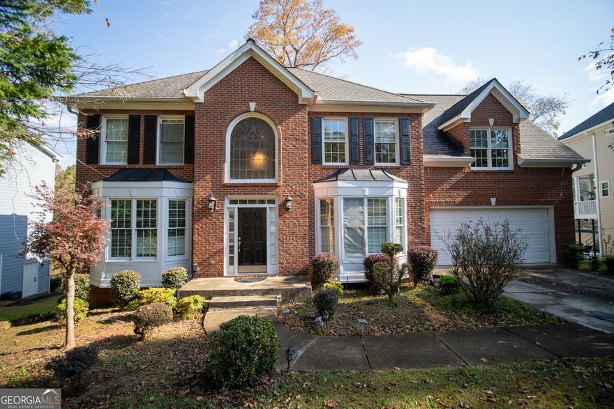 Coming Soon - 11/13, Interior pictures coming soon! Beautiful brick front traditional 4BR/3.5BA home in one of Suwanee's most desirable lake communities! This spacious property is perfectly situated on a scenic lot with private lake access and a personal dock, offering a peaceful retreat with plenty of room for living and entertaining. The main level features a two-story foyer, formal sitting room, and separate dining room ideal for gatherings. The two-story living room boasts large windows that flood the space with natural light and offer serene lake views. The large kitchen includes an eat-in breakfast area, ample workspace, and access to the deck. A half bath and laundry room are conveniently located on the main level. Upstairs, the oversized primary suite features vaulted ceilings, a large walk-in closet, and a spa-like bathroom with a separate tub, standing shower, and double vanities. The upper level also includes three additional bedrooms, each with large closets, that share a full bathroom providing plenty of space and comfort for family or guests. The finished basement adds approximately 1,000 sq ft of additional living space, featuring a full bathroom, recreation room, and media room perfect for a home theater, gym, or play area. Outside, enjoy lakefront living with your own private dock, ideal for fishing, kayaking, or relaxing by the water. The property also includes a two-car garage for convenience and additional storage. Excellent location close to top-rated schools, parks, restaurants, and shopping, with easy access to major highways. A rare opportunity to own a lakefront home in one of Suwanee's most sought-after neighborhoods!