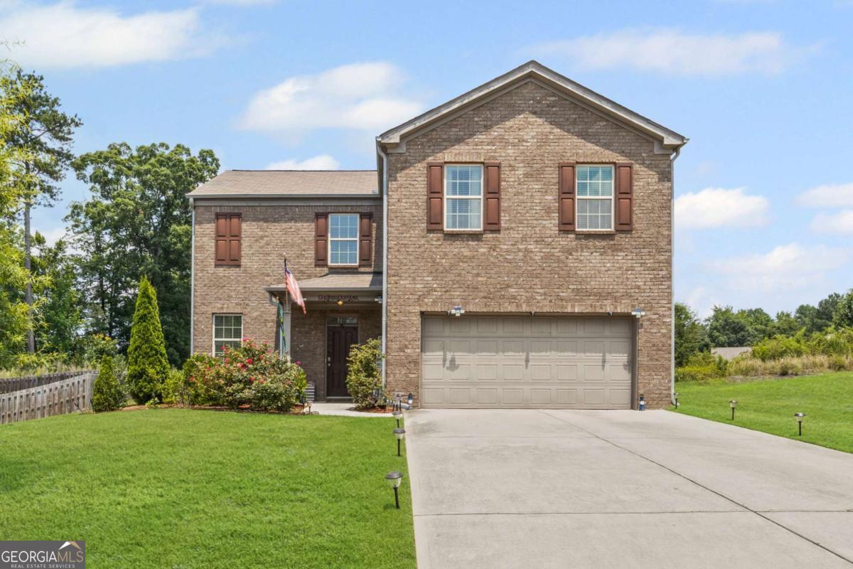 This spacious 4 bedroom, 2.5 bath home sits on almost half an acre, offering a rare combination of space and privacy in a quiet Douglasville community. The main level features a comfortable, open layout with a large living room, dining area, and kitchen with center island, perfect for everyday living and entertaining. Upstairs, all four bedrooms are thoughtfully arranged, including a generous primary suite with a walk-in closet and dual vanity. Step outside to enjoy the flat, private backyard, ideal for play, pets, gardening, or simply relaxing outdoors. Conveniently located near I-20, schools, and local amenities, this home offers the best of both space and accessibility. A must-see for buyers looking for comfort, value, and room to grow.
