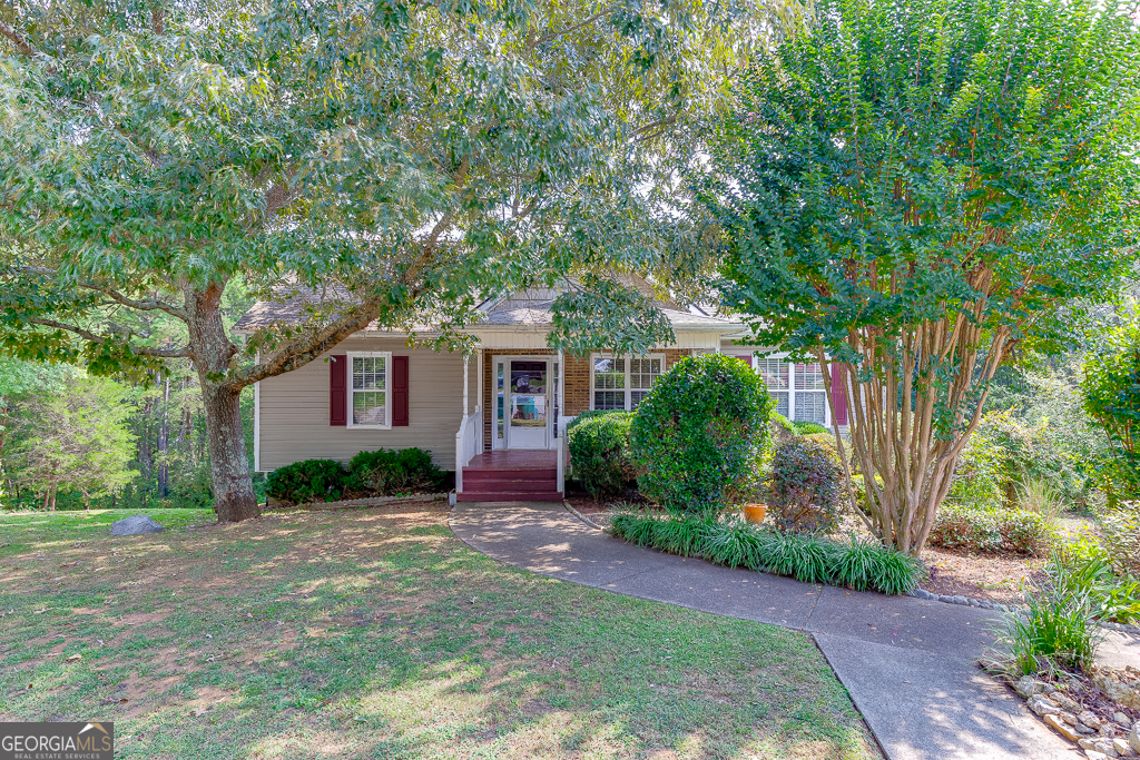 NEW Roof, NEW HVAC, NEW Water Heater! MASTER ON MAIN. Perfect Home on cul de sac lot with 1.5+ acres that back up to Conservation Area. Main level features living room, fire place, laundry room and eat in kitchen. Master Bedroom with walk in closet and 2 additional bedrooms and bathrooms. Partially finished terrace level has a lot of shelves for storage, 2 garage door openings, finished half bathroom and 2 additional flex rooms. Screened in patio off the kitchen overlooks the expansive and private backyard and perfect for entertaining or relaxing while enjoying the scenic backyard and wild life. Long driveway perfect for multiple cars and shed for additional storage. Close to downtown Adairsville, 5 minutes from I-75 and ONE EXIT FROM BUC-EES!