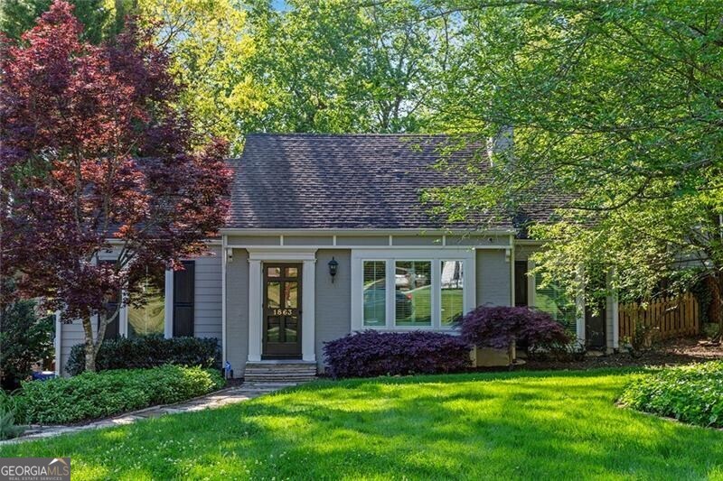 Picture perfect renovated home in popular Collier Hills neighborhood! Truly a special gem w/ features that include refinished hardwoods, tons of natural light, designer lighting throughout. New kitchen w/ marble counters/ breakfast bar, custom white cabinetry, stainless appliances, bar area w/ blue cabinetry and gold hardware, antique glass backsplash. Open floor plan w/ a family room addition w/ gas fireplace, built in's. Spacious primary suite addition w/ double vanity, good closet space. Great back deck that leads to a professionally landscaped fenced in back yard and firepit area. Meticulously maintained and a prime location seconds to top area parks, golf, schools, shopping and restaurants.