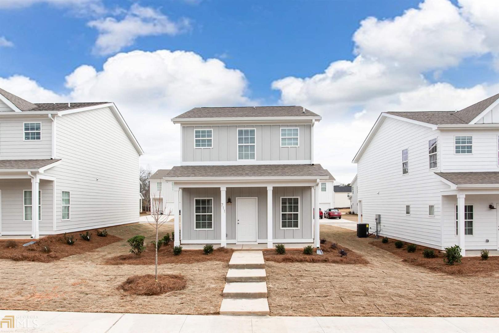 Fantastic new construction in westside neighborhood. This home features finishes, normally found only in houses, well above this price point. The color palette is soft and neutral, featuring whites and grays throughout. The floorpan is open, perfect for entertaining or enjoying family time. The photos speak for themselves, the home is lovely. The location is minutes from the loop, Normal Town, UGA Health Sciences campus, and Bishop Park. Maintenance is easy, with HOA maintaining lawn care. **Photos are of 711 Vincent Drive W which are comparable to the unit listed**