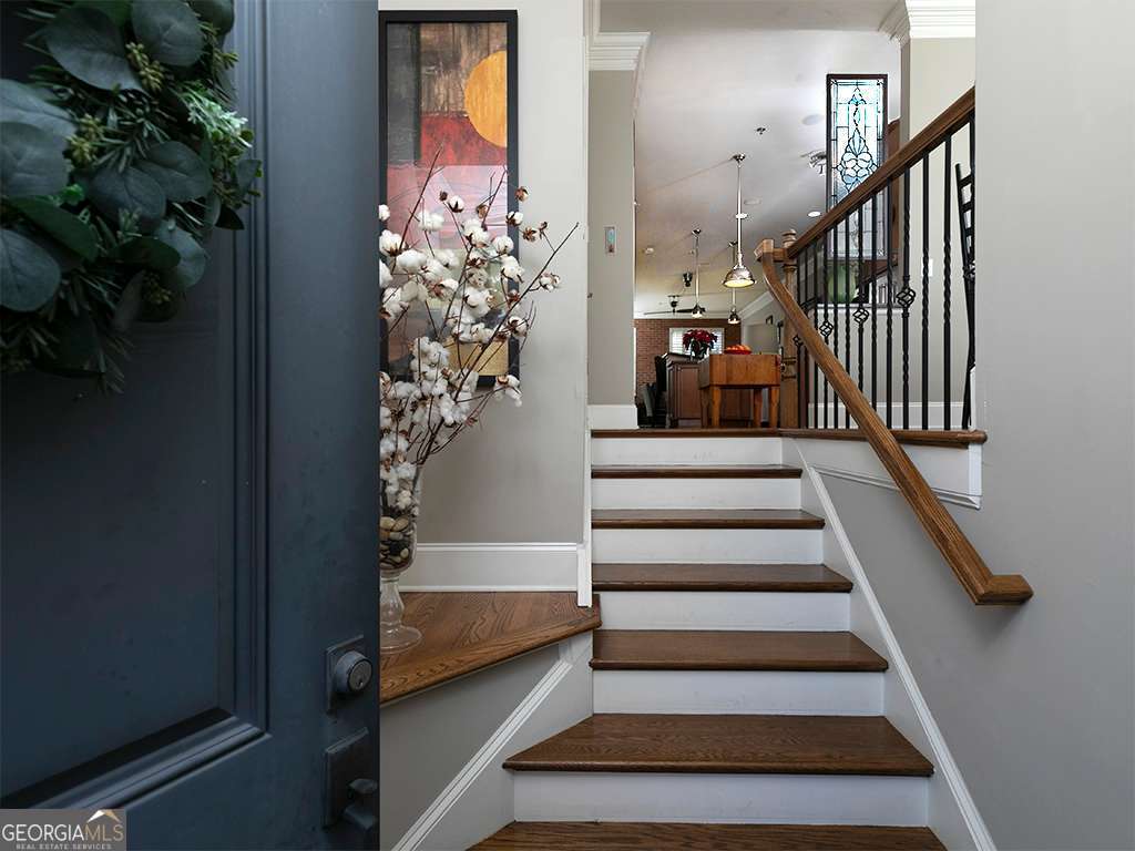 This Townhome in sought after Emerson Hill Square, a gated Townhome Community, is within walking distance to the Historic Marietta Square . The home boasts of four stories with an elevator that provides easy access to all four levels. Great views are provided by the two large rooftop decks with views of Kennesaw Mountain, Marietta Square, sunsets and fireworks on the Fourth of July. Be sure to check out the pictures. The views are phenomenal. These rooftop decks also provide remotely controlled awnings for easy enjoyment at any time of the day. The main living space presents an open floor plan with a well-designed Kitchen which is in the center of the main level. The Family room with a cozy Fireplace and the Dining area creates this fabulous open Floor Plan. The third level has two bedrooms. The Primary Bedroom Suite has a walk in closet and a spa-like Bathroom with the newly renovated shower. The Guest bedroom is ensuite with walk in closets. The 4th floor is a haven for relaxation and entertaining. You have a custom bar with an ice maker. This Bonus room spans the length of the Townhome that has access to both Roof-top decks for those amazing views. The ground floor has a 2 car garage. and there is also an Ensuite Bedroom on this level. This Townhome is one of a kind. Open House scheduled for 1/11/2025 from 2 pm to 5 pm.