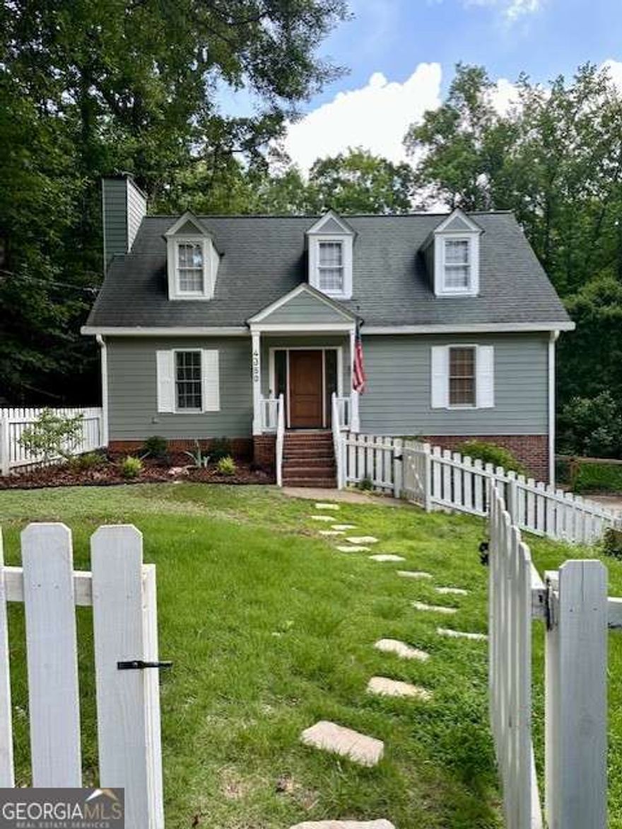 Welcome Home! You'll never want to leave once you step into this charming 4-bedroom, 2.5-bathroom cottage nestled on 5+ stunning acres in Cobb County. Yes, 5+ acres-a rare find in this area! Everything you need is right here. Enjoy the spacious chef-style kitchen, renovated bathrooms, and master suite on the main floor. Two bedrooms upstairs provide extra space, while an additional bedroom is conveniently located near the 2-car garage.  Evenings on the brand-new back deck with a refreshing glass of choice? A must! If you're a golf enthusiast, you'll love the golf pad in the back yard, making it easy to practice your swing while relaxing near the new fire pit-a perfect weekend routine.