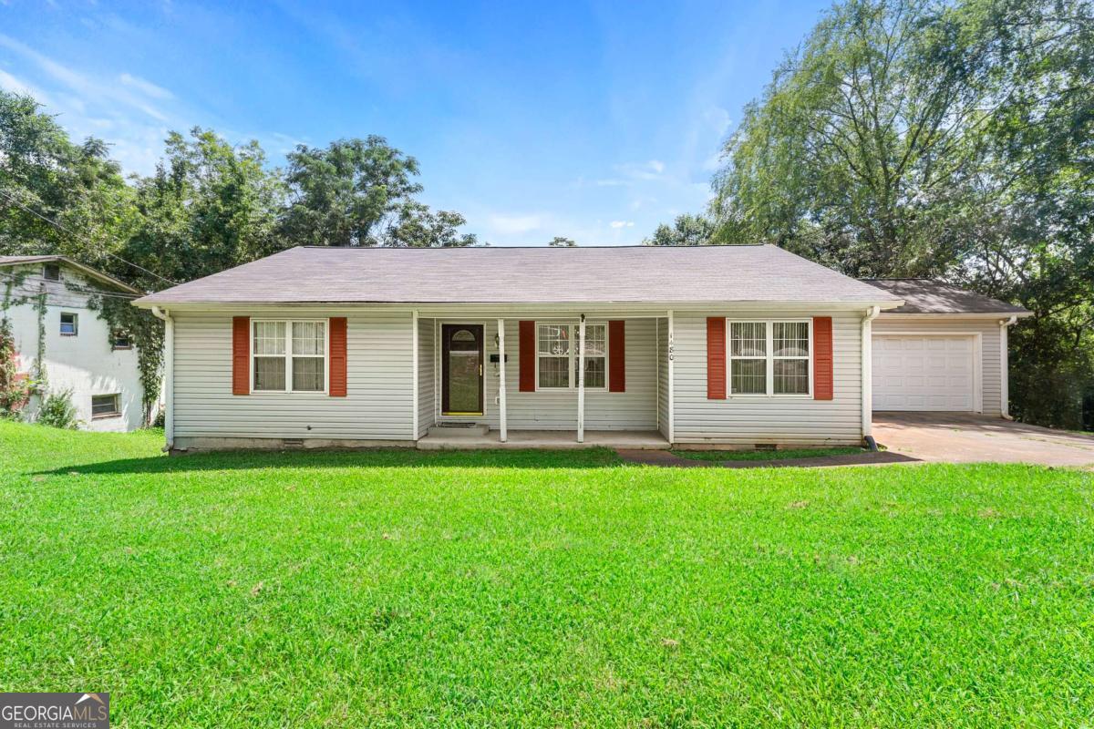Welcome to your ideal 3-bedroom home just 5 minutes from the vibrant UGA campus! This rare find is perfect for students, roommates, first-time homebuyers, or savvy investors seeking rental income. Conveniently located on a bus line, this home features a spacious layout with two primary bedrooms-one offering a large walk-in closet, and the other with two closets-providing flexibility and privacy. Step outside to a huge backyard, perfect for outdoor living or entertaining. A 2-car garage-hard to find in this area-adds both convenience and value. Plus, a large crawl space offers excellent additional storage options. New roof and water heater 2023. No HOA, no rental restrictions and the opportunities are endless. Just minutes from shopping, dining, entertainment, and the energetic nightlife of downtown Athens. Home is being sold AS-IS. Don't miss your chance-schedule your showing today and make this versatile home yours!