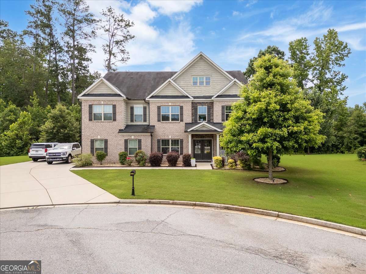 This stunning home in Vineyard Place sits at the end of a peaceful cul-de-sac, offering both privacy and space. With three expansive stories, this residence boasts 6 spacious bedrooms and 4 luxurious baths, making it ideal for an extended family or those who love to entertain. Upon entering, you're welcomed into a grand, open-concept living area that seamlessly blends comfort and style. The main floor features a guest bedroom, perfect for visitors or multigenerational living, along with a dedicated office/study space that provides the perfect setting for working from home. With three separate living spaces, there's no shortage of room for everyone to spread out or come together for family gatherings. The heart of the home is the chef-inspired kitchen, which effortlessly flows into a charming sunroom-ideal for enjoying morning coffee or relaxing while soaking in natural light. A formal dining room, large enough to accommodate your extended family, completes the main living area. For more intimate meals, the cozy dining nook offers the perfect space for everyday dining, making sure your home meets every need, from casual family dinners to special occasions. Whether you're hosting or relaxing, this house truly has it all! The oversized primary bedroom is a retreat to the eyes, featuring a double vanity and generous his/her closets that offer plenty of storage. The remaining bedrooms are generously sized as well, each with ample closet space to accommodate a growing family. The third floor is the crown jewel of the home, offering the ultimate privacy for family members who need their own space. This level includes a spacious media room, perfect for movie nights or game days, as well as two additional bedrooms that are perfect for teenagers, guests, or a home gym. With its own separate living areas, the third floor makes for an ideal retreat while still keeping you connected to the heart of the home.