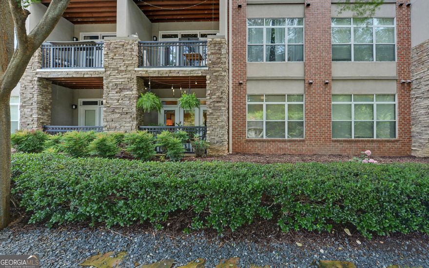 Charming Grant park Condo with modern touches and unbeatable location.  Welcome to this beautifully updated ground-floor condo in the heart of Grant Park just steps from the Atlanta Zoo, the Beltline, coffee shops, and all the neighborhood favorites that make this area so desirable.  Offering a rare blend of comfort, convenience, and security, this pet-friendly home is perfect for city dwellers who crave walkability and charm.  Enjoy a spacious open layout with upgraded lighting and durable LVP flooring throughout.  The stylish kitchen features a tile backsplash, and the bathroom boasts a separate tiled shower and soaking tub for a spa-like retreat.  Drapes and custom window treatments are included, along with a stacked washer and dryer for added convenience.  Relax on your private stacked-stone accented covered porch, or take advantage of the upgraded fitness center.  This unit offers controlled building access, interior fire sprinklers, and a security system for peace of mind.  A fenced and gated lot with an assigned parking space ensures easy, secure and gated parking right outside your door.  Close to top-rated schools, major healthcare centers, downtown Atlanta, and some of the city's best restaurants, this condo truly checks every box.  Don't miss your chance to live in one of Atlanta's most sought after communities.  Enjoy wonderful amenities that include a club room featuring games and TV, business center, outdoor seating and grill area, valet trash, 24 hour CCTV, and a dedicated mail room. Close to The Beacon Atlanta, Zoo Atlanta, Glenwood Park, Madison Yards, the BeltLine, and East Atlanta Village.