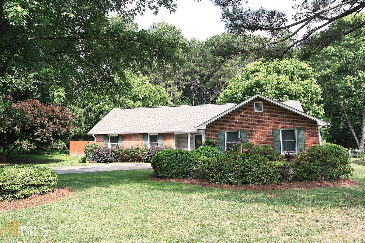 Amazing Parkview Ranch! Open floor plan, with new granite counters in the light filled kitchen, zero step entry, huge screened in back deck, extra large storage building, level driveway and level fenced in yard, side entry garage with storage room, very low maintenance exterior, newer windows, newer roof. Newly installed hardwood floors, fire pit, Great location, Lots of storage in the outbuilding. Easy commute to Emory,CDC.