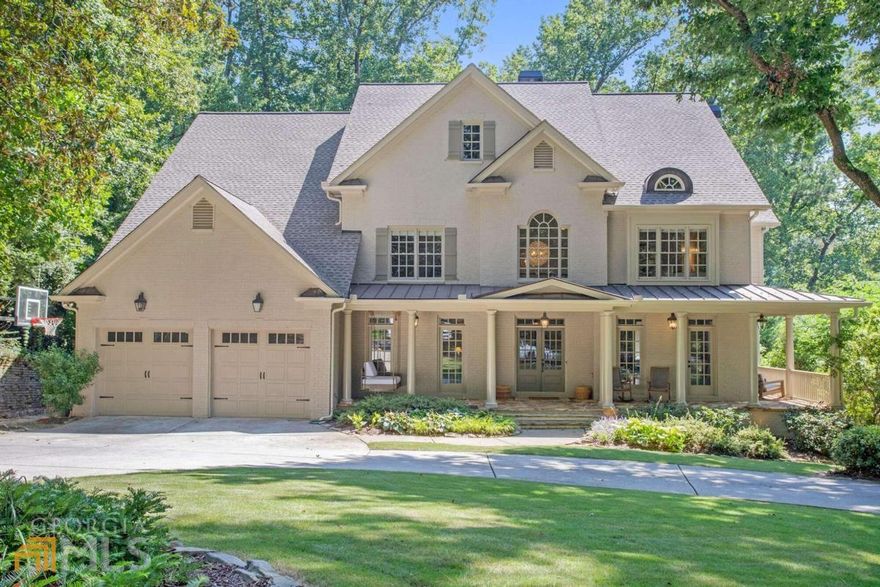 This home is not to be missed! Gorgeous 6 bedroom/5.5 bathroom traditional home in located Sarah Smith ES. So many wonderful updates and finishes throughtout. Welcoming rocking chair front porch leads to large entrance foyer. Sleek dining room with dry bar plus sitting room with room for piano. Renovated chef's kitchen with quartz countertops, new Wolf gas range with double ovens, SS appliances and breakfast area that opens to two-story great room with fireplace. Main level guest suite with full bath plus convenient mudroom includes small office area. Large screened porch overlooking professionally landscaped back yard with firepit area and children's play gym. Upstairs features generously-sized owner's suite with fireplace, sitting area, vaulted ceilings and dual walk-in closets. Luxe primary bath has been completely updated with heated floors, quartz countertops, soaking tub and large walk-in shower. Three additional bedrooms up all with custom closets. Terrace level has been totally updated with bedroom/full bath, gym, playroom, family room with wet bar plus a powder bath. Two car garage and loads of storage.