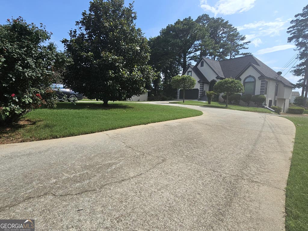 Photo of 2461 Highland Golf Course Drive SE, Conyers, GA 30013 (MLS # 10785910)