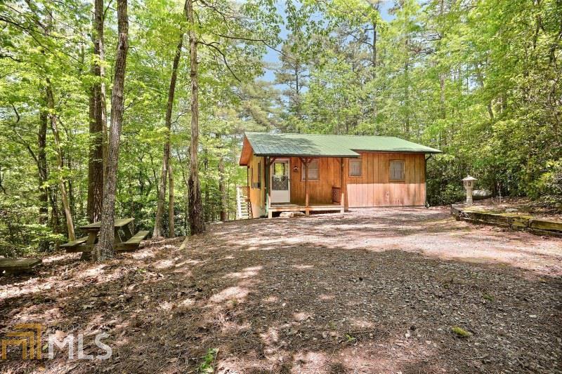 This lakefront cabin is both affordable and convenient! Escape the daily grind of the city life & retreat to this lakefront cabin in the mountains. Cozy cabin is situated nicely on the hillside of Nottely Lake complete with a dock in the Canal Lake Subdivision. Imagine your Summers filled fishing, boating, jet-skiing or relaxing by the water s edge. Entertain your guests in the picnic area in front or on the back deck with a great view of Nottely Lake. Interior is cozy with living, kitchen & dining combined & 2 BR s are just enough to entertain! Retreat to North Georgia and make some mountain memories!