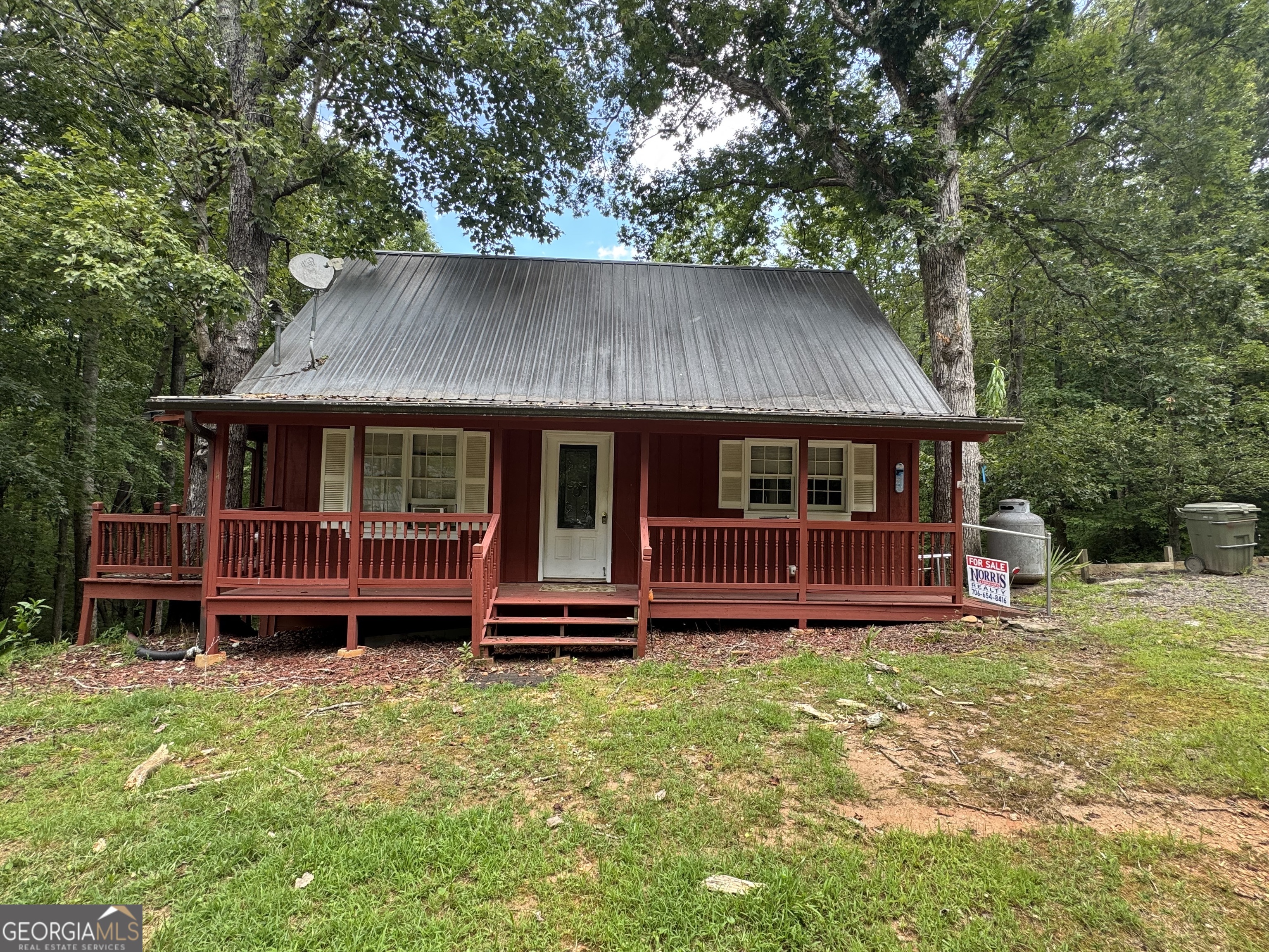 Nice fixer up cabin in mountain setting. Large wooded 2 ac lot with creek and pond. Perfect weekend get away.
