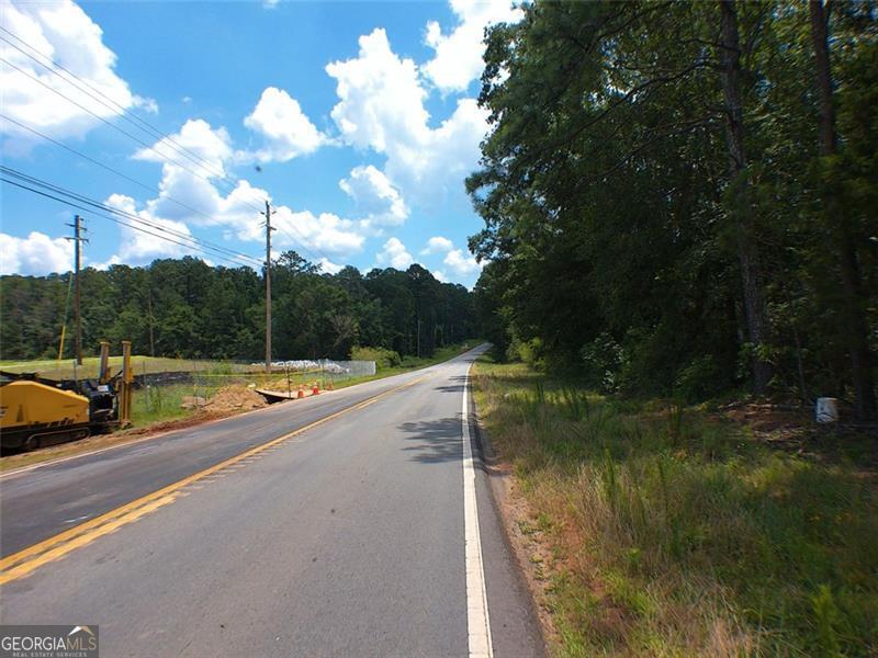 286 feet road frontage on Alcovy Rd and 95 feet on Briarpatch Rd, pond on property, seller is relate to listing agent