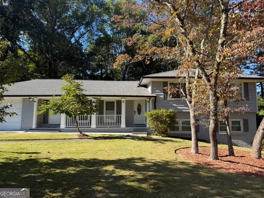 Welcome to this beautifully updated split-level home in Dunwoody, offering a perfect blend of comfort, versatility, and modern living. The main level features three spacious bedrooms and two renovated bathrooms, designed for both function and style. The remodeled kitchen shines with granite countertops, marble flooring, custom cabinetry, and stainless steel appliances, flowing seamlessly into the dining area and family room. From there, the dining room opens to a lovely screened porch-a peaceful space to enjoy your morning coffee or unwind at the end of the day. The lower level adds exceptional flexibility, featuring a private secondary living area with two bedrooms, a full bath, laundry area, and a full kitchen with an island and breakfast bar. Perfect for multi-generational living, guest quarters, or a private office suite, this space adapts to a variety of needs. Set on nearly three-quarters of an acre, the fenced backyard offers room to design your own outdoor retreat-whether it's a pool, garden, or entertainment area. Recent updates include a new composition roof with ridge vent, new gutters, and fresh exterior paint, ensuring durability and curb appeal. Ideally located less than a mile from I-285 and just minutes from Brook Run Park, shopping, dining, and local schools within the highly regarded Dunwoody area, this home delivers both convenience and lifestyle. Whether you're seeking a family home, a multi-generational layout, or a smart investment, this Dunwoody GEM combines modern upgrades, flexible spaces, and a prime location-all ready to welcome you home.