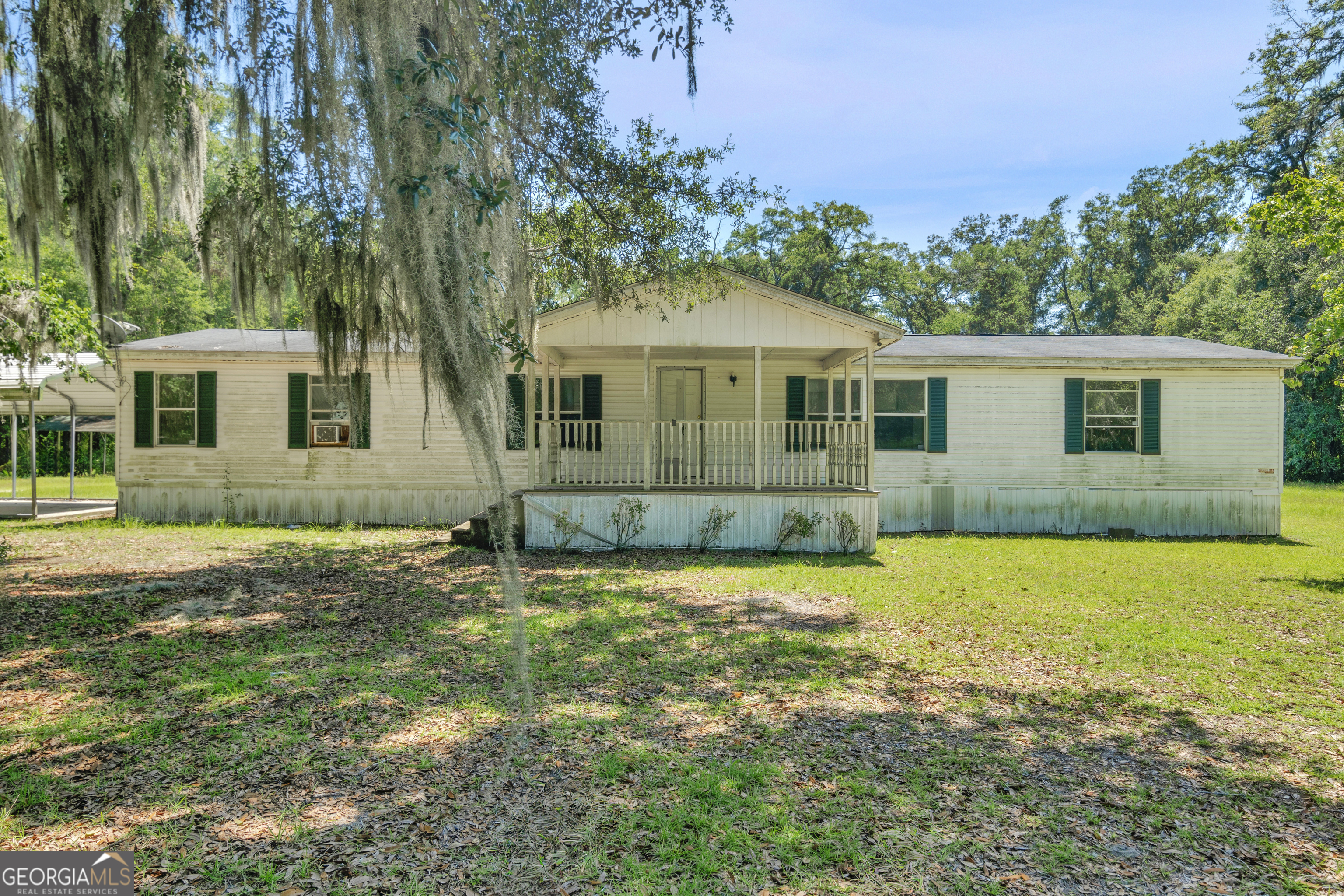 Welcome Home! Whether you are a first-time homeowner looking to add your own personal touch, or an investor looking for a project, this is the ideal investment. The bones are great and only needs your creative touch to freshen this home up! This property also comes with over 4 acres of land. This 3-bedroom, 2-bathroom manufactured home has the ideal floorplan with major potential. 131 Live Oak Dr features a large living room, an eat-in kitchen, and large bedrooms. This welcoming neighborhood is waiting for you to join this tight-knit community! Opportunities like this don't last long, hurry home! Property being sold AS-IS. Seller has never occupied home therefore there are no disclosures available. Claims made in this listing are deemed correct by seller, but buyer understands it is their responsibility to confirm all info