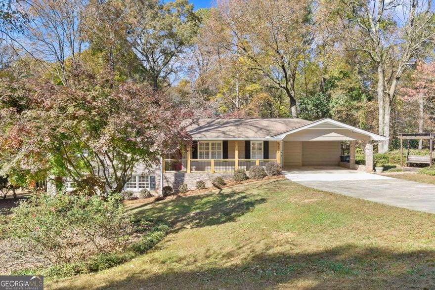 Welcome home to this beautifully updated 3-bed, 2-bath ranch in Lilburn. This home has been completely renovated and has a full basement. One side of the basement has been partially finished, offering a flexible bonus room with plenty of storage space and closet space-perfect for a home office, guest suite, or second den. The other side is unfinished and could be used as a workshop.   The main floor features an open floor plan with a spacious great room and cozy fireplace that flows into a separate dining area. The kitchen shines with brand-new appliances, tile backsplash, new counters, a stylish coffee bar, and plenty of cabinet space. Enjoy the convenience of an eat-in kitchen with an adjacent laundry area. All bedrooms have new carpet and roomy closets. The primary suite includes a renovated bath with a new vanity, reglazed tile, and a sleek glass shower door. The secondary bath is equally impressive with new finishes, fixtures with a modern feel.   Outside, you'll love the large, flat 0.48-acre lot with an expansive deck-ideal for grilling, play, pets, and entertaining. The location is unbeatable: just a short stroll to Old Town Lilburn, with its beautiful park, greenway for walking/running ,shops, and restaurants. Enjoy all that Lilburn offers from, from concerts and festivals to food truck nights and holiday celebrations. This home is located in the desirable Arcado Elementary, Trickum Middle, and Parkview High school cluster.  Additionally, it is minutes from Lawrenceville Highway (US29) where you will find even more convenience with nearby grocery stores, restaurants and more. Come see for yourself all this home has to offer.