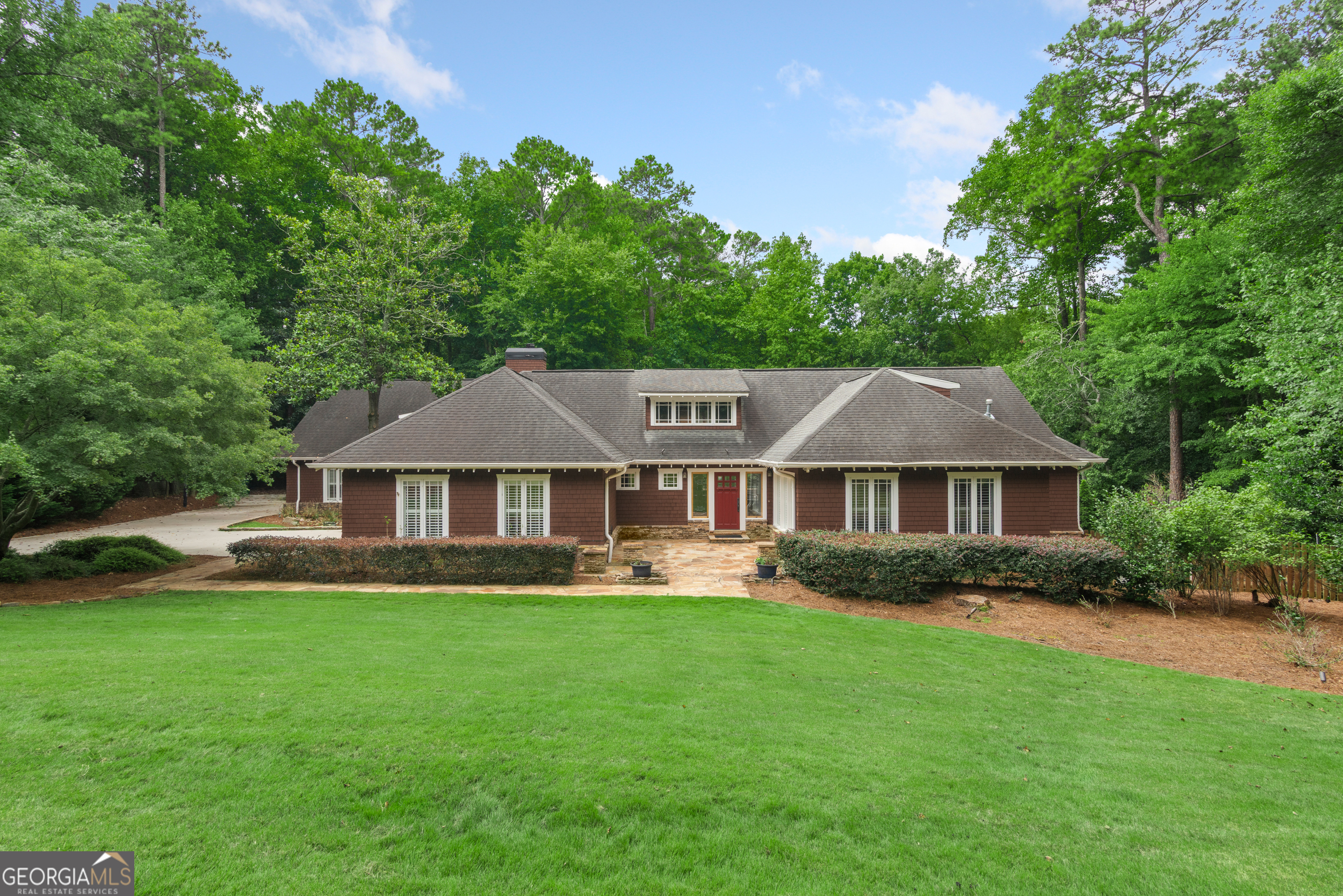 A Rare Blend of Beauty, Comfort, and Functionality - This Craftsman Executive Home has a sophisticated architectural design that evokes a cozy New England charm with modern luxury. Specifically the home has: Double Main Level Primary Suites-very unique feature * Entertainers dream Backyard Resort-Style Pool, Outdoor Kitchen & Dining, Firepit Patio & Terrace level Exercise Room, Media / Game Room opens to back patio * Plus New Terrace Indoor Kitchen & New Huge Bathroom directly accessible to outdoor kitchen- making outdoor dining & entertaining exceptionally easy & efficient * 3-Car Side Entry Garage plus extra parking areas on driveway for parties/guests * Terrace Level In-Law / Nanny Suite with wide zero degree entry shower, handicap-wheelchair accessible. Can accommodate multi-generations/seniors * Large Separate Upper Room -with ensuite bathroom. Multi Use Options -Home Office, Art/Dance/Music Studio, Hobby / Craft Space, Wo/Man Cave, or Library / Collection Showcase Room * Wired sound system and wireless internet booster / routers * Mature Hardwoods & Evergreen Trees provide privacy on this exceptional level lot * Separate Side Entry Mud / Laundry Room with locker cubbies, slate floor, large utility sink & wall of pantry pull out cabinets * Large Entry Courtyard with Slate Patio with Craftsman Front Door & Artisan Side Glass Panels evoking the true Arts & Crafts style * Grand light-filled 2-story great room w/upper style dormer windows, beautiful architectural wood beams, stone fireplace all open to kitchen. Owner upgrade & improvements include: Resort style in ground heated saltwater pool -wading ledge & waterfall spa, pebbletech surface and stamped concrete patio border. * Renovated kitchen with professional chef stove- extra large double- wide counter depth refrigerator, double dishwashers, wine/beverage fridge, high end cabinetry & matte finish solid stone countertops. * Renovated bathrooms including terrace level bathroom with zero degree extra large shower - wheelchair / handicap accessible * Outdoor Kitchen - Gas Grill, Extra Large Egg, stone bar counter and retractable awning * Complete terrace level indoor kitchen installed directly opens to outdoor kitchen * New deck all along back with durable Trek decking, lighting and underdeck stay dry drain ceilings * Completely new driveway with multiple extra driveway parking pads * Master Landscape Yard- Plan features Irrigation, lighting and outdoor sound system, fenced organic garden, separate rose & hydrangea gardens, dog run, mature hardwoods, all enclosed with high wooden architectural privacy fence * Custom flagstone firepit and stack stone hardscapes * New double pane windows and French Doors * 2 Generac whole house supplemental electric generators * All new outside HVAC condensing units, New terrace level heat pump* Custom-organized closet systems installed throughout (bedroom closets, linen closets, laundry room and pantry) * New Nest thermostats with app remote control * New Paint and Carpet on Main Level * Plantation Shutters throughout. Whether hosting, relaxing, creating, or working from home, this property has been designed to meet your every need. PRIME LOCATION- Minutes to the Perimeter. Convenient to Brookhaven, Buckhead and Alpharetta via 400, Easy access to I-285 * Close to Premier Shopping, Dining, Nightlife & Entertainment in Sandy Springs, Dunwoody, Brookhaven, & Alpharetta * Close to Top Rated Public & Private Schools * Many Nearby Parks, Public & Private Golf & Tennis Clubs