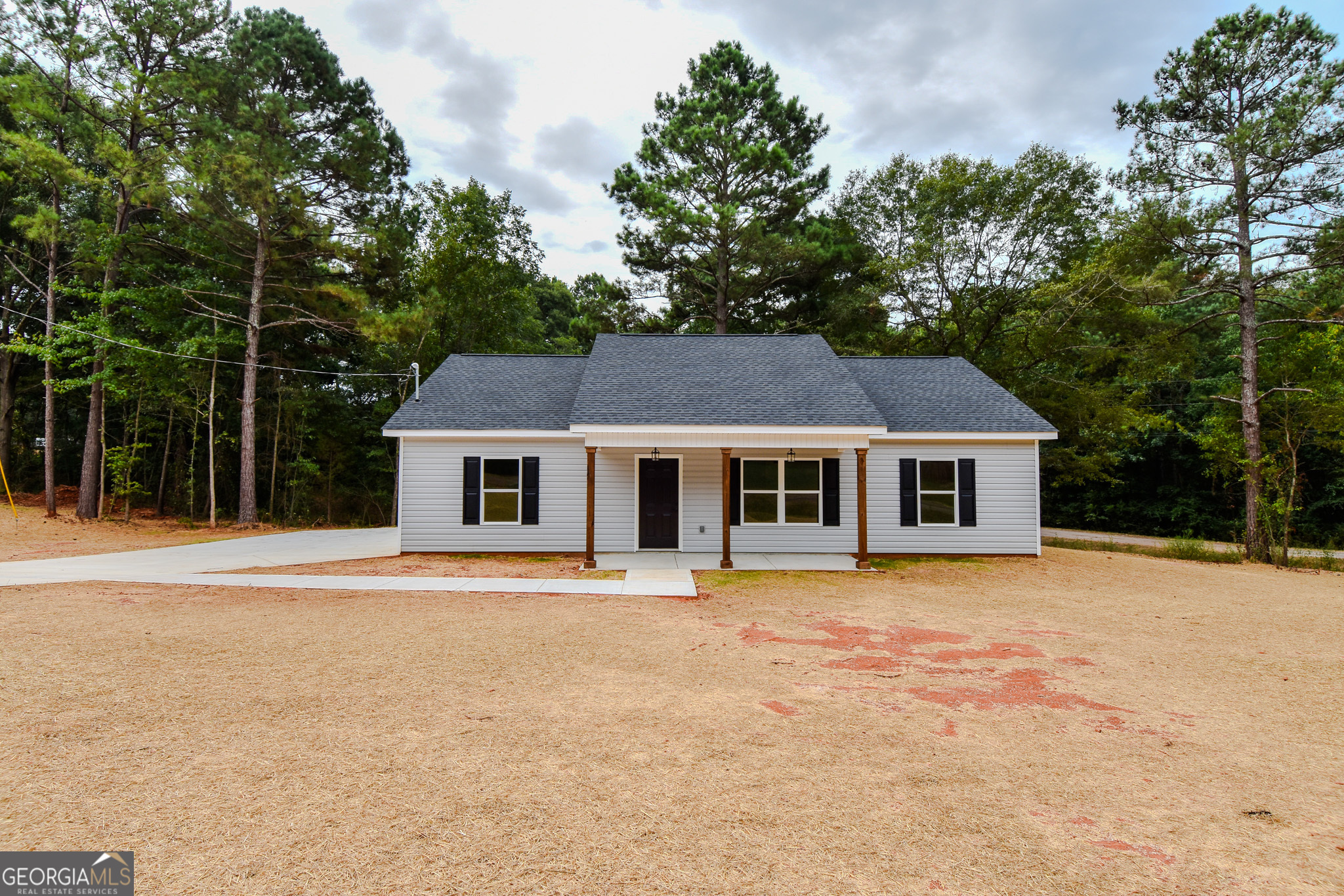 Welcome to this stunning new construction ranch-style home that perfectly blends modern convenience with classic charm! Boasting three spacious bedrooms and two beautifully appointed bathrooms, this open floor plan is designed for both comfort and style. Step inside and be greeted by a bright and airy layout that seamlessly connects the living, dining, and kitchen areas-ideal for entertaining family and friends or enjoying cozy nights in. The heart of the home features gorgeous granite countertops throughout, adding a touch of elegance and durability to your culinary adventures. Retreat to the private split bedroom plan, where you'll discover a luxurious primary suite complete with double vanities and generous walk-in closets, providing ample storage and a serene escape. The additional bedrooms are equally impressive, perfect for guests, kids, or a home office. You'll love the convenience of a dedicated laundry room, making chores a breeze! Situated on a level lot, this home offers a blank canvas for your outdoor oasis-imagine the possibilities! Don't miss out on this fabulous opportunity to make this beauty your own! Schedule your tour today and experience the perfect blend of modern living and thoughtful design!