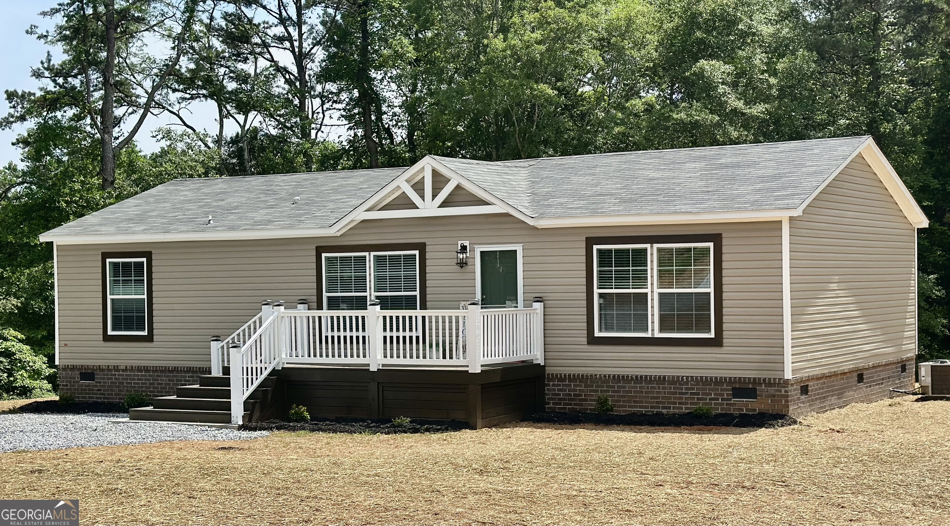 **Seller is offering to pay up to $10,000 in concessions towards buyers closing cost** Another unique offering from Progressive Homes (PH); a premier land-home developer of Manufactured Homes in North Georgia- "Where Ordinary becomes Extraordinary. This sheet-rocked 3 bedroom, 2 bath home has an open floor plan and a large mud room. It includes an all-brick permanent foundation, a heat pump, OSB wrapped exterior, custom stained decks, upgraded insulation, energy efficient windows, stainless-steel appliances, a remote-controlled electric fireplace, a programmable thermostat, and a double sliding door off the dining area leading to a custom-built deck. No expense was spared to provide a truly unique enhanced low-cost quality living experience. All Progressive Homes lots are graded to maximum use of your land, capture the best views, and provide for adding a garage or workshop where possible. This home meets all FHA, VA, and Conventional Finance Standards and includes a 1-year house warranty. See the attached pictures to view the details that distinguish a Progressive Home from others. See Plat, home is located on tract 2. Tax records reflect the land only prior to being subdivided and homes added.