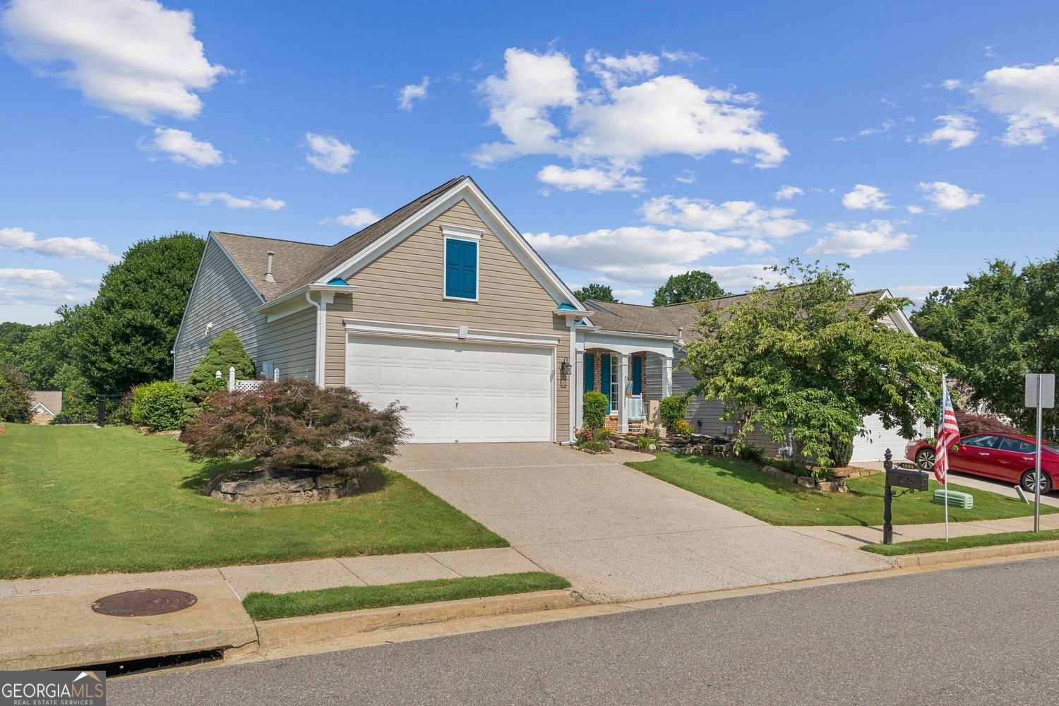 Welcome home to this beautifully maintained 2-bedroom + dedicated office / 2-bath RANCH, ideally situated in a popular Forsyth County neighborhood. Designed for effortless living and entertaining, the open-concept layout flows seamlessly from the fireside family room-featuring large windows with serene views of the private backyard-to the inviting dining area and a sun-drenched sunroom that brings the outdoors in. A sliding glass door opens directly to the back patio, perfect for morning coffee or backyard BBQs with friends. The split bedroom plan offers optimal privacy, whether you're hosting guests or accommodating a roommate or family member. The generously sized Main Level Primary Suite provides ample space for oversized furnishings and features an updated en-suite bath and a generous walk-in closet. On the other side of the home you'll find a dedicated office and a spacious secondary bedroom served by a full, shared bath. The backyard is professionally landscaped for privacy and features maintenance-free turf, ensuring year-round beauty with minimal upkeep. Located in a peaceful setting yet just minutes from shopping, dining and easy access to GA-400 this home offers the best of both worlds. Just minutes from Northside Forsyth Hospital, the new Cumming City Center and numerous shopping & dining options.