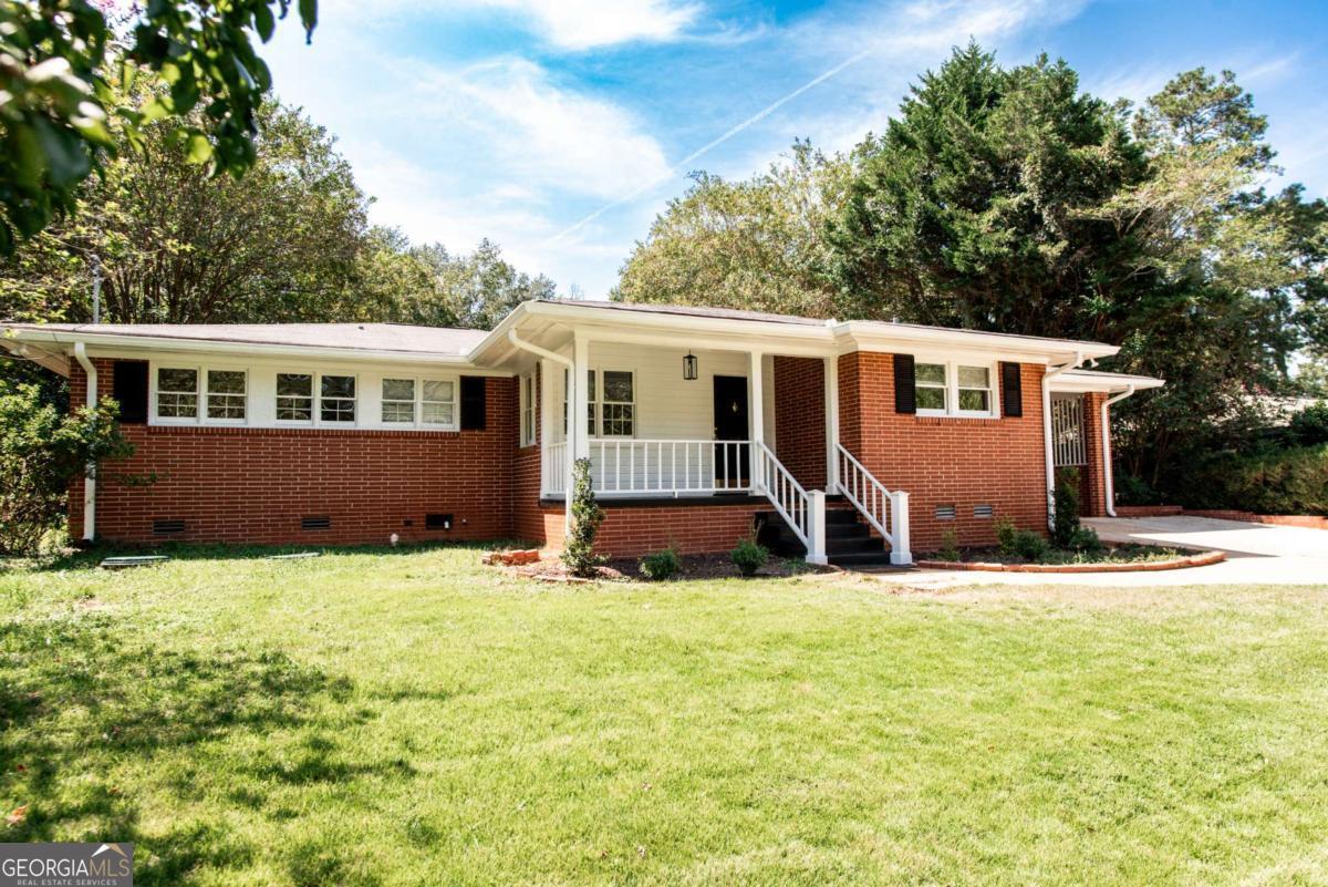 Welcome to Green Acres, one of East Athens' most desirable and family-friendly neighborhoods. This charming 3-bedroom, 2-bath home offers potential in a location that makes life easy - just minutes from the UGA Vet School, a short drive to Main Campus and Downtown, and close to shopping and dining on the Eastside. Inside, you'll find a layout that's practical and flexible. The main living and dining areas flow together, while a den off the dining room opens up more possibilities. Whether you're envisioning a playroom, second living area, or home office, this bonus room adapts to your needs. Step through the den's exterior door into a fully fenced, shaded backyard. It's ideal for pets, children, or simply enjoying the outdoors. A cozy patio offers the perfect spot for morning coffee, weekend cookouts, or evenings with family and friends. With its great neighborhood, flexible layout, and outdoor living, 335 Greencrest Dr is ready for its next chapter.