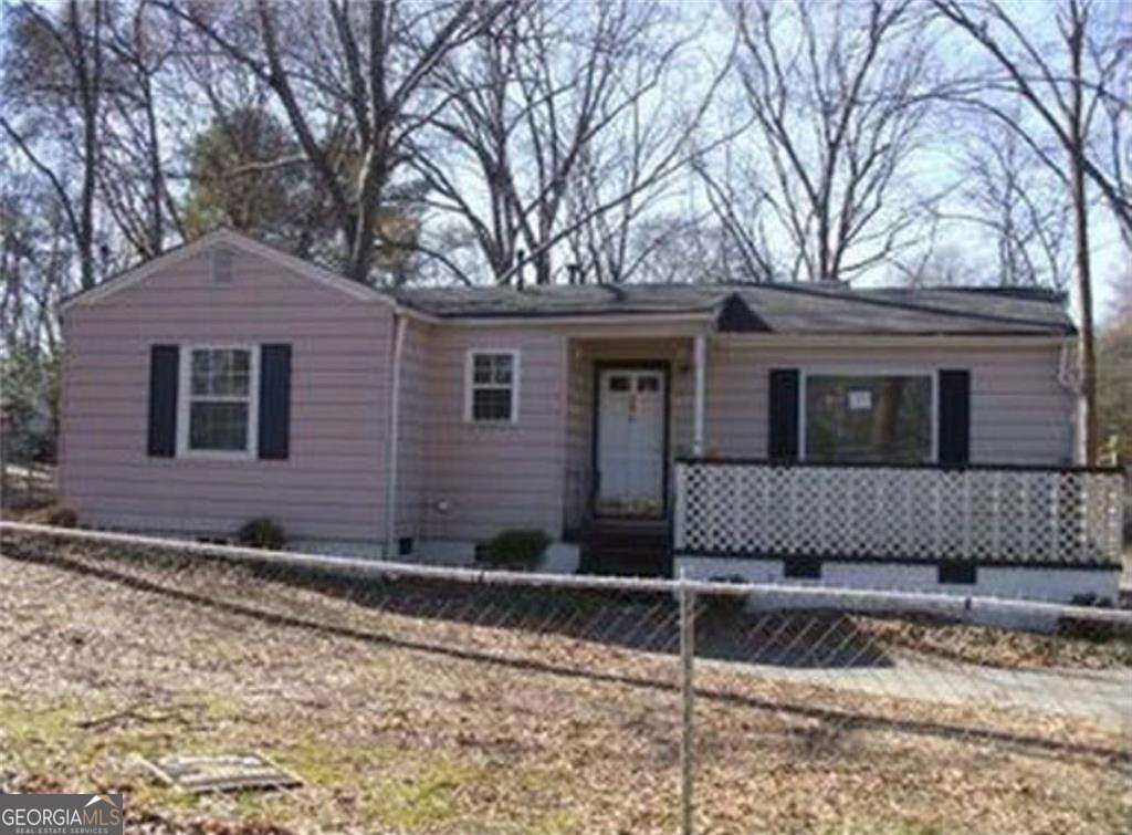 Charming 2-bedroom, 1-bath ranch in Forest Park! This cozy single-level home offers an open-concept family and dining area with an eat-in kitchen featuring a breakfast bar, crisp white cabinets, and included refrigerator. The master bedroom is on the main level with a walk-in closet, while the mix of carpet and wood flooring adds warmth throughout. The property comes equipped with a water heater and a brand-new air conditioning system, giving added comfort for daily living. Outside, enjoy the fenced backyard perfect for pets or outdoor gatherings, plus a covered front porch and driveway parking. Located on a 0.28-acre lot with public utilities already in place, near public transportation, schools, and local attractions such as the Atlanta State Farmers Market, Clayton County International Park, and just minutes from downtown Atlanta. Ideal for first-time buyers, small families, or investors looking for a great opportunity. Don't miss it-schedule your showing today!