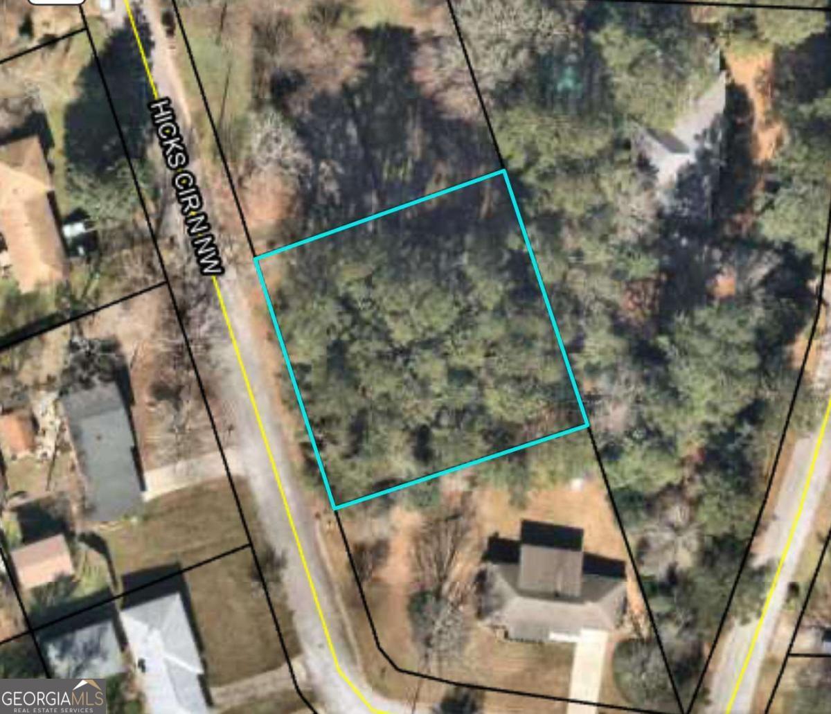Prime Fenced Lot in the Heart of Conyers - Minutes to I-20 and Old Town! Discover the perfect opportunity to build the home of your dreams on this beautifully wooded, undeveloped lot in a highly sought-after and convenient Conyers neighborhood. Located just minutes from Interstate 20 and within walking distance to the charm of Old Town Conyers-with its shopping, dining, local events, and seasonal festivals-this lot offers both privacy and accessibility. Fully fenced and surrounded by established homes, this property provides a rare blend of seclusion and convenience. Whether you're looking to build your forever home or invest in a rapidly growing area, this lot is a fantastic opportunity. All utilities available at the street. No HOA. Don't miss this chance to create your dream home in one of Conyers' most walkable and vibrant communities!