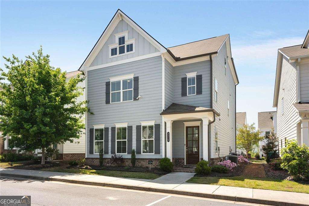 Discover this nearly-new, beautifully designed home that blends modern style with everyday comfort-perfectly located in the heart of Smyrna, GA. Just steps away from Smyrna Market Village, Belmont Village, Fox Creek Golf Course, neighborhood parks, local restaurants, and Adams Pond, you'll love having everything you need within walking distance. Inside, you're welcomed by an open, sunlit floor plan with rich hardwood floors and upscale finishes throughout. The stunning gourmet kitchen is built for both weeknight dinners and weekend entertaining, featuring a custom vent hood, quartz countertops, a spacious island, stainless steel appliances, a walk-in pantry, and one of two beverage coolers. Upstairs, the serene primary suite is your personal retreat with a custom walk-in closet and spa-inspired bathroom with a glass-enclosed shower and double vanities. A versatile landing area works perfectly as a home office, playroom, or cozy reading nook. The third level offers even more flexibility with a large family room, an extra bedroom, and a full bath-great for hosting guests, a roommate, or a multigenerational setup. A stylish custom bar with sink and a second beverage cooler is ready for movie nights, game days, or casual get-togethers. Out back, relax in the fenced yard or enjoy coffee on the private patio. A two-car garage with an EV charging station adds convenience for modern living.