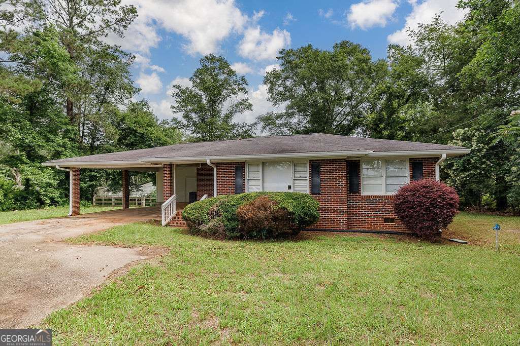 This 2 bedroom 1 bath brick ranch has a lot to offer for the price. Walking through the front door you will notice the large living room that adjoins the kitchen dining area. On the back side of the home there are 2 spacious bedrooms and 1 bath. This home also has a large laundry area with wood paneling and lots of windows. Hardwood floor throughout the main living areas.