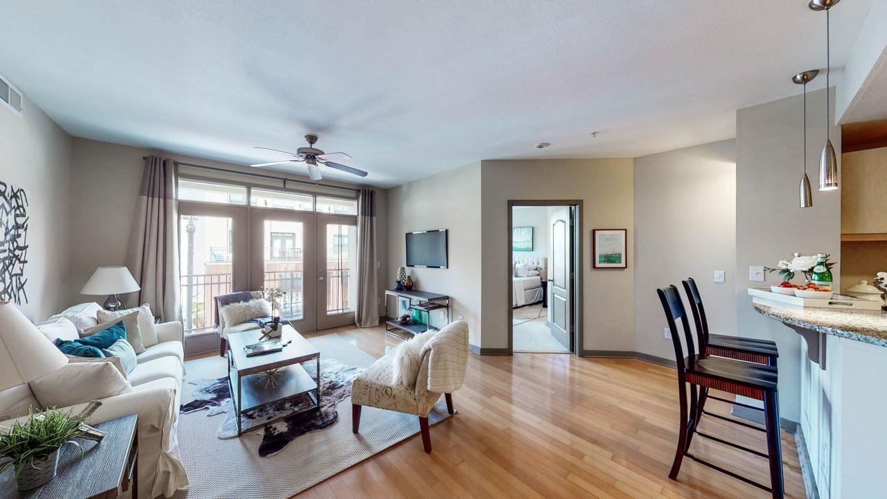 Atlanta City Living! Light and bright 2 bedroom/2 bath condo on the 4th floor. Largest one level 2/2 floorplan in The Element with 1263 square feet. Beautiful hardwood floors, freshly painted, open concept living space with spacious family room open to the kitchen and separate dining/office space. The kitchen has loads of counterspace, excellent storage, a breakfast bar, great lighting, mid tone wood cabinets and granite counters. A separate dining room that makes a perfect flex space for a home office or extra living space. Large owner’s suite with a private bath including double vanities, soaking tub, separate shower, and a huge walk-in closet. Private secondary bedroom with great closet space and a full bath with soaking tub/shower combination. Relax on your private, covered balcony and enjoy the sights and sounds of the city. This home comes with two deeded and secured parking spaces. Easy to park in the parking deck and walk in on the same floor! The Element has a great reputation of keeping the property in tip top condition and attending to the residents. Your monthly fees include a gorgeous pool, fitness facility, conference areas, clubhouse, pet friendly outdoor areas, secure parking, clean and maintained common areas, serene outdoor spaces, concierge services and secure entries. The Element is a quiet, relaxed community with easy access to The Downtown Connector, Buckhead, Midtown, Westside, GA Tech, Atlantic Station…walk to shops, eateries, a movie theater, outdoor activities, and Atlantic Station Dog Park!