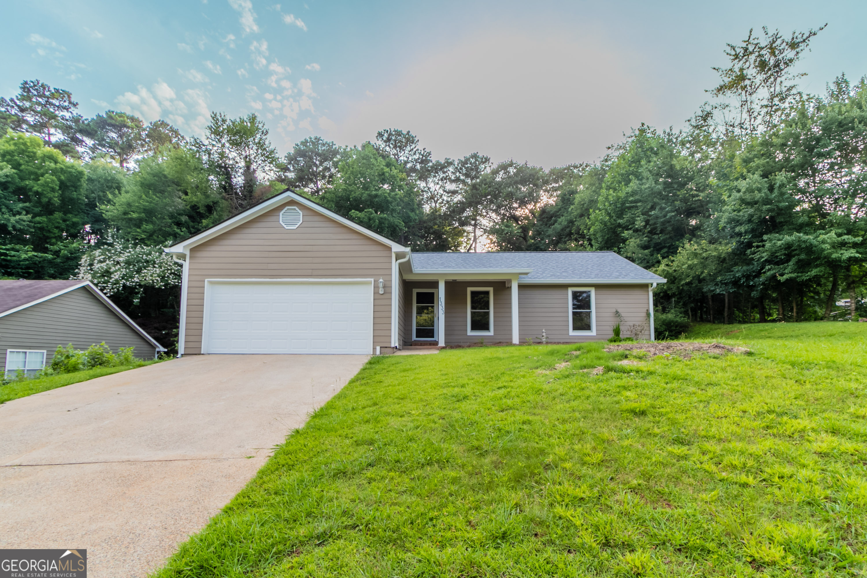 This charming 3-bedroom, 2-bath single-story home boasts a fresh interior with full paint, new LVP flooring, and plush carpet. The kitchen features painted cabinets, sleek quartz counters, a new stainless sink, and dishwasher. A replaced garage door adds both function and curb appeal.